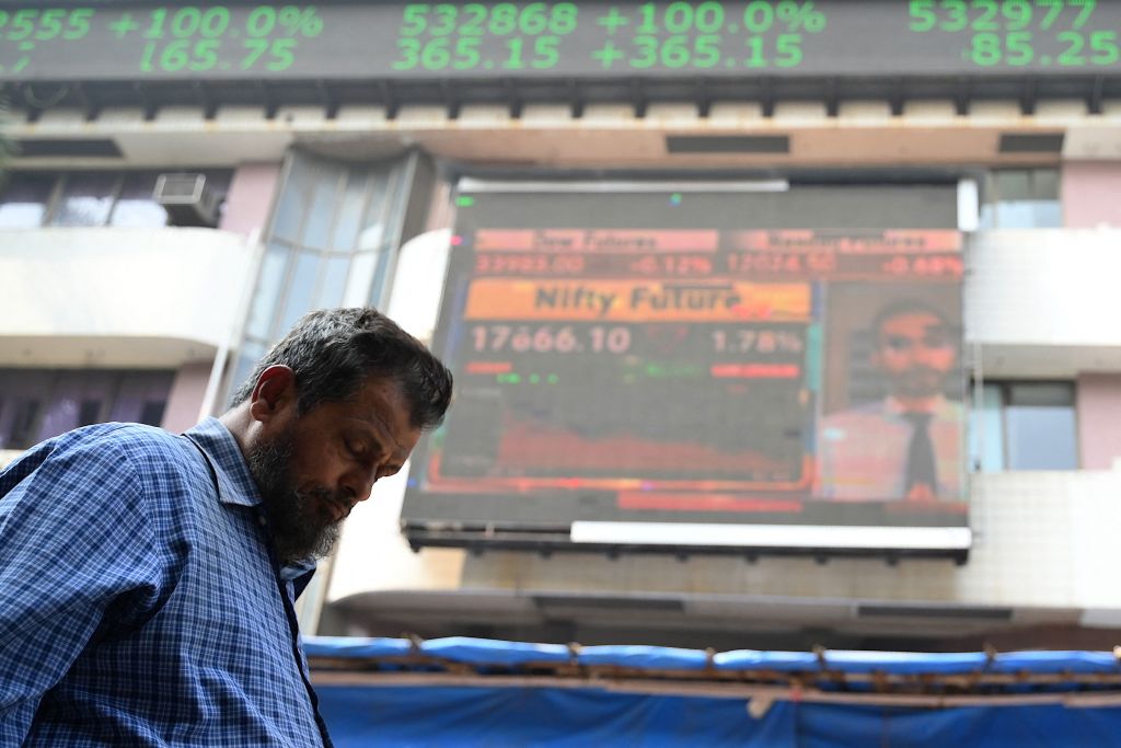 A pedestrian walks past the Bombay Stock Exchange (BSE) building in Mumbai on January 27, 2023—the day trading in the Adani Group was halted. (Sujit Jaiswal—AFP/Getty Images)