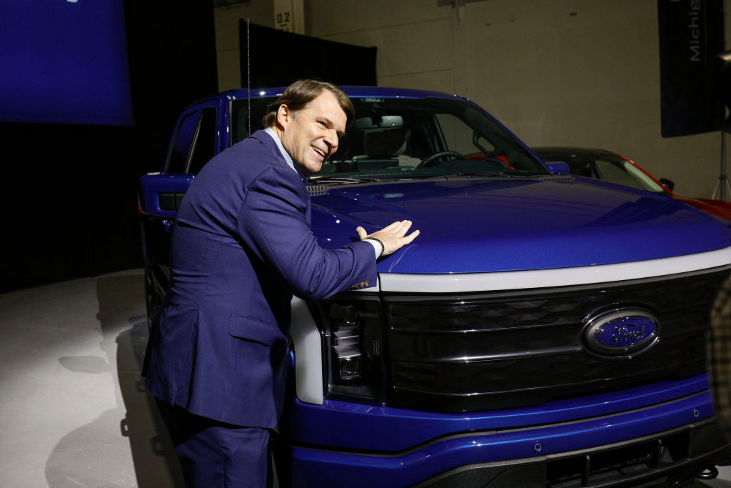 Ford CEO Jim Farley pats a Ford F-150 Lightning truck before announcing at a press conference that Ford Motor Company will be partnering with the world's largest battery company, a China-based company called Contemporary Amperex Technology,  to create an electric-vehicle battery plant in Marshall, Michigan, on February 13, 2023 in Romulus, Michigan. Part of a multi-billion dollar investment, the battery plant will provide approximately 2,500 jobs. (Photo by Bill Pugliano/Getty Images)