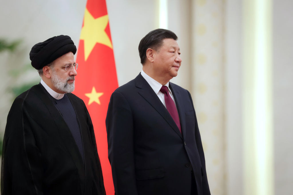 Iranian President Ebrahim Raisi is welcomed by Chinese President Xi Jinping with an official ceremony in Beijing, China on Feb. 14, 2023. (Iranian Presidency / Handout/Anadolu Agency via Getty Images)