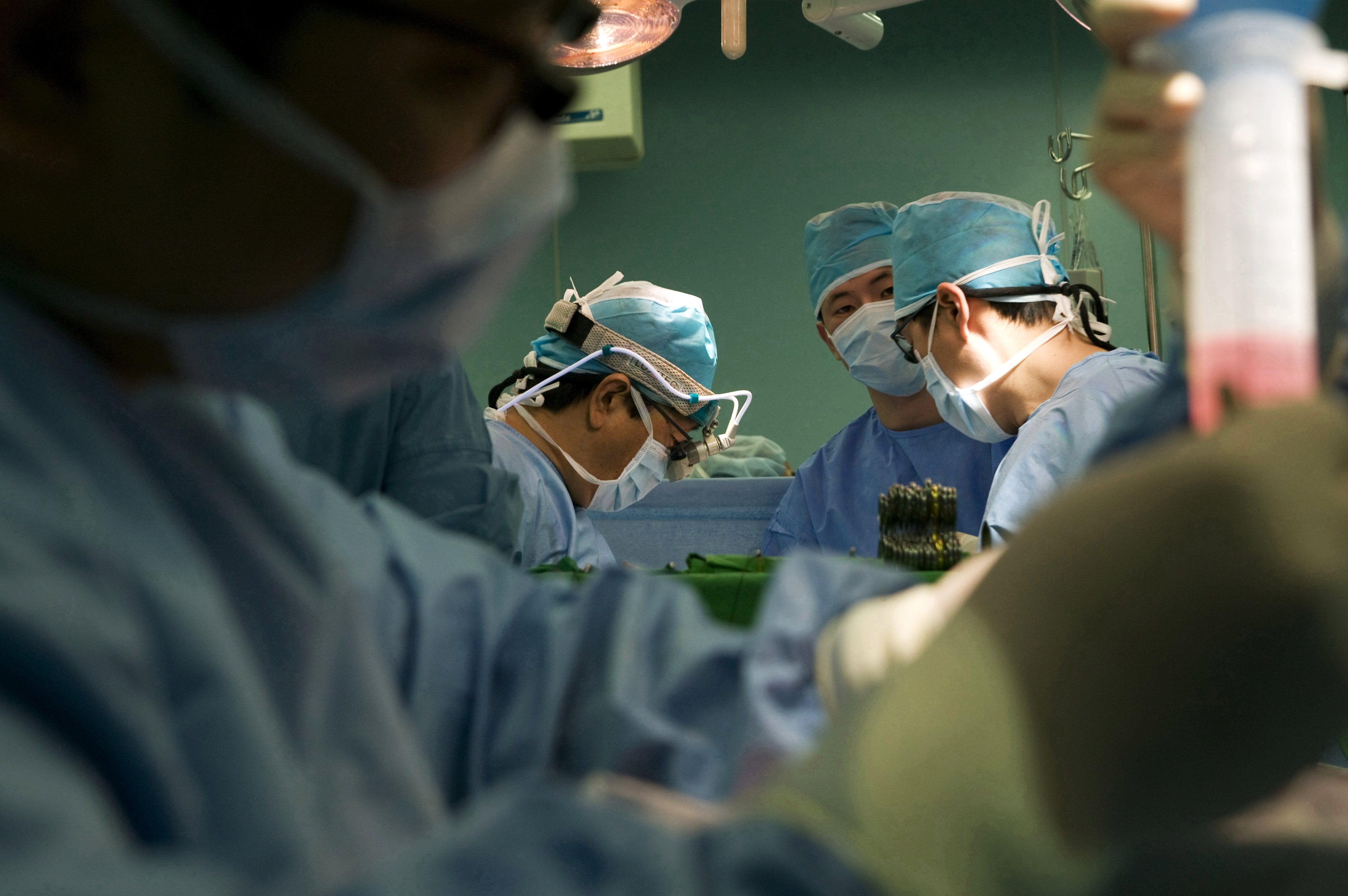A group of surgeons operate at a hospital in Seoul in November 2008. (Universal Images Group/Getty Images)