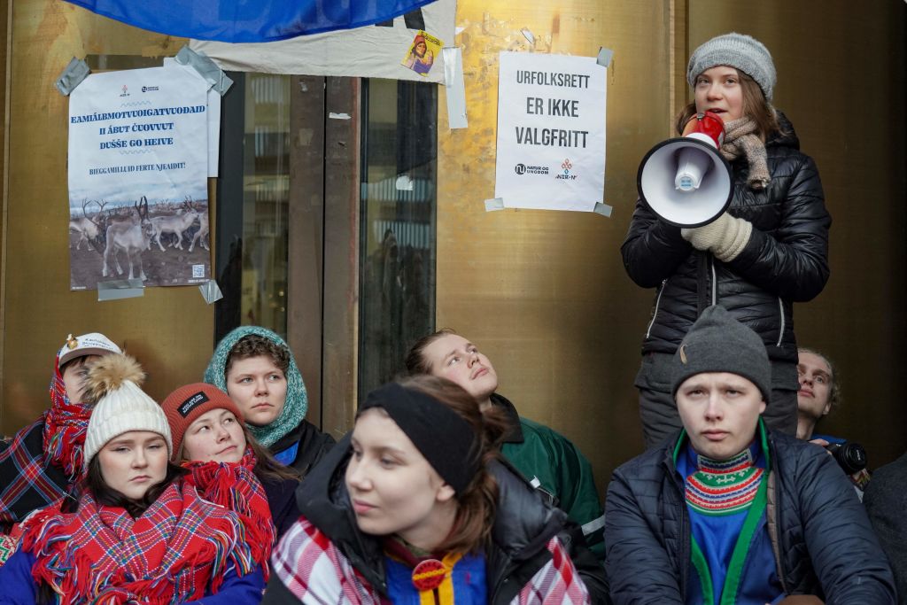 Sweden's Greta Thunberg and other young climate activists from the "Nature and Youth" and "Norwegian Samirs Riksforbund Nuorat" groups block the entrance of Norway's Energy ministry in Oslo, on February 27, 2023. (Ole Berg-Rusten—NTB/AFP/Getty Images)