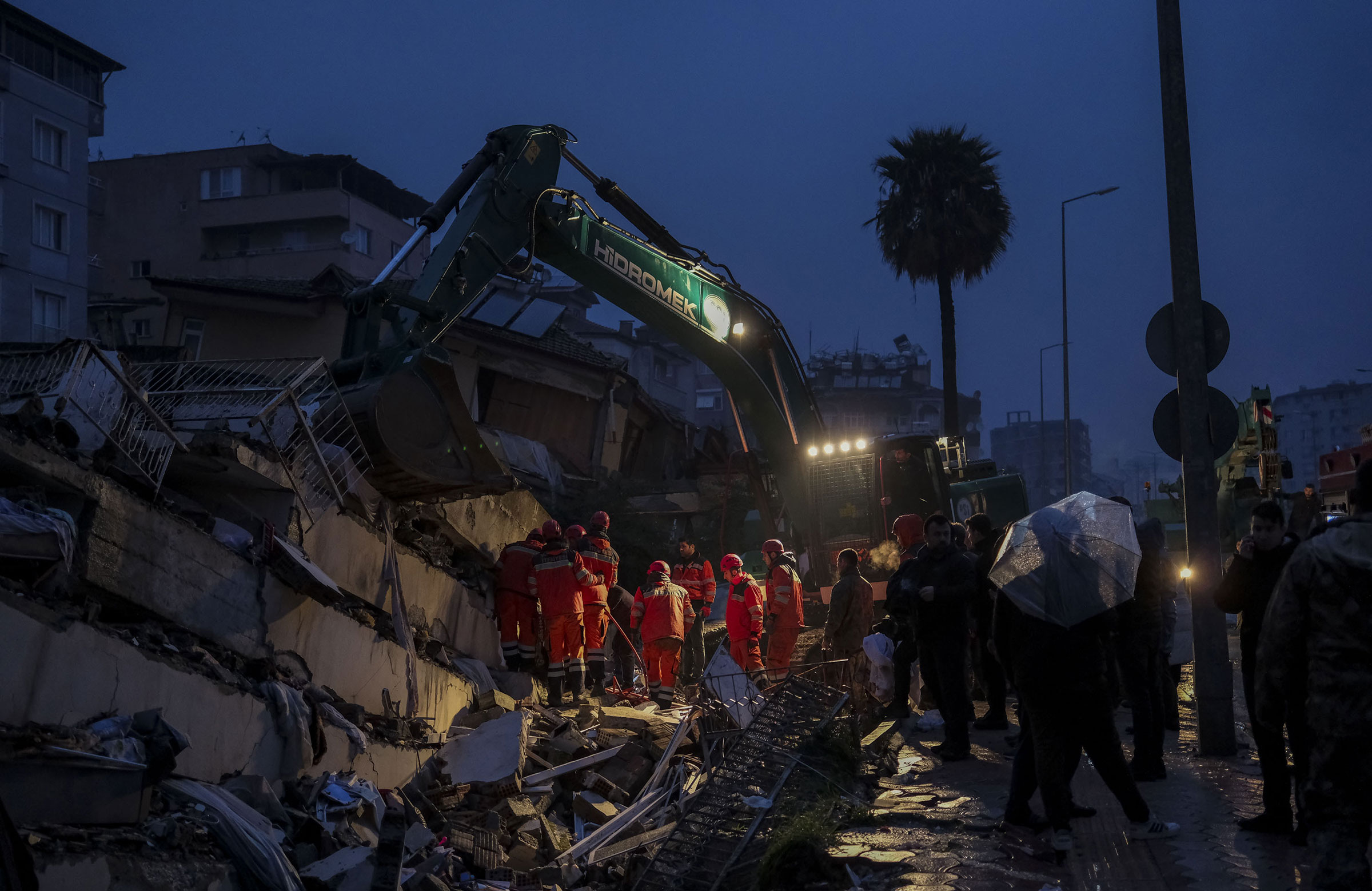 People mourn as rescue efforts continue at collapsed building in Hatay, Turkey. (Ercin Erturk—Anadolu Agency/Getty Images)