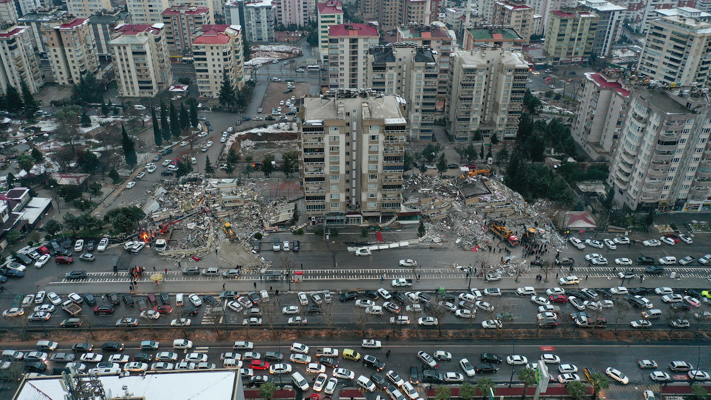 An aerial view shows search and rescue operations continue at a collapsed 15 story building after 7.7 and 7.6 magnitude earthquakes hit Kahramanmaras, on Feb. 6, 2023. (Halife Yalcinkaya—Anadolu Agency via Getty Images)