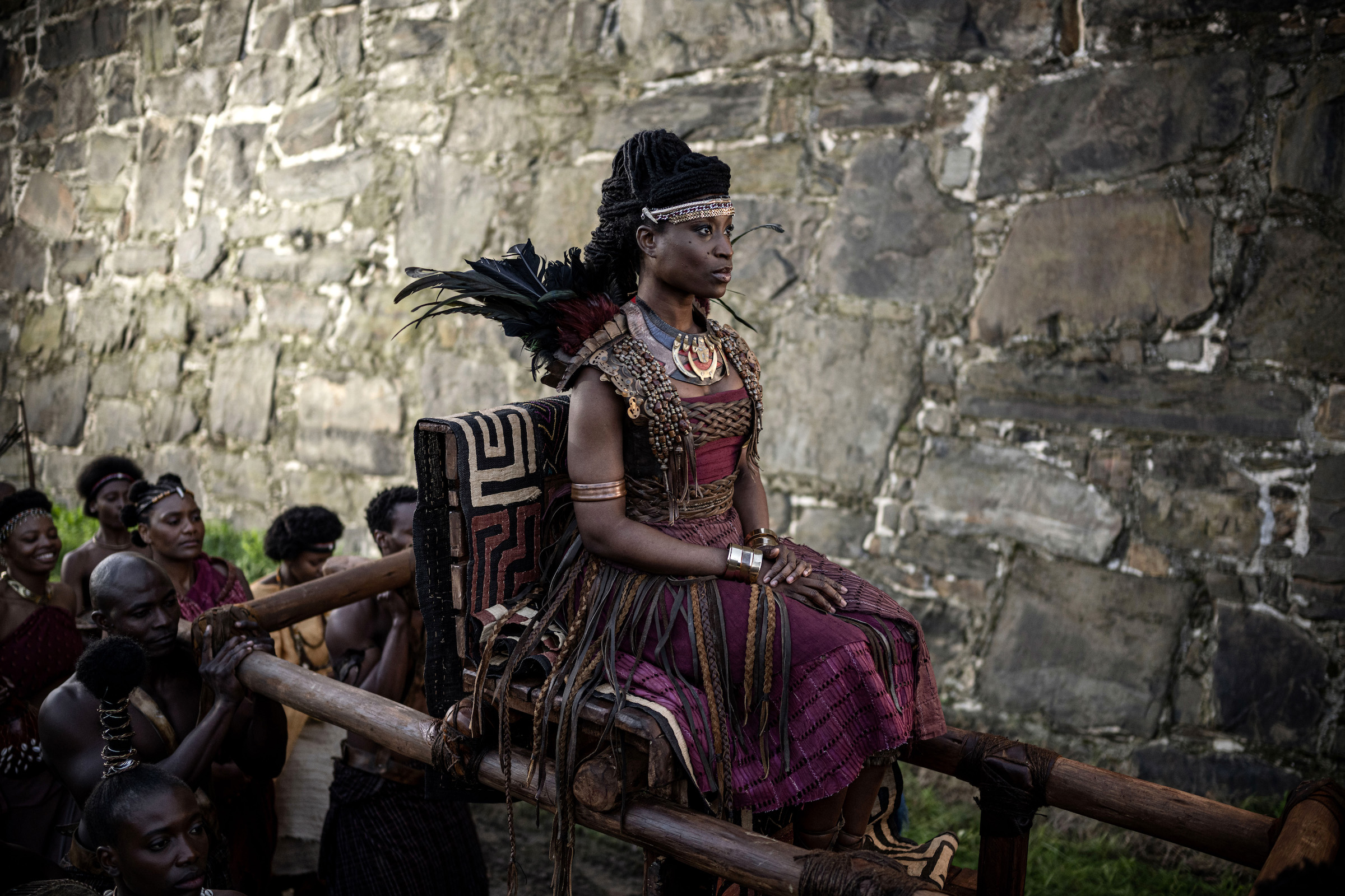 Njinga (Adesuwa Oni) and her entourage approach the Portuguese governor's compound. (Joe Alblas—Netflix)