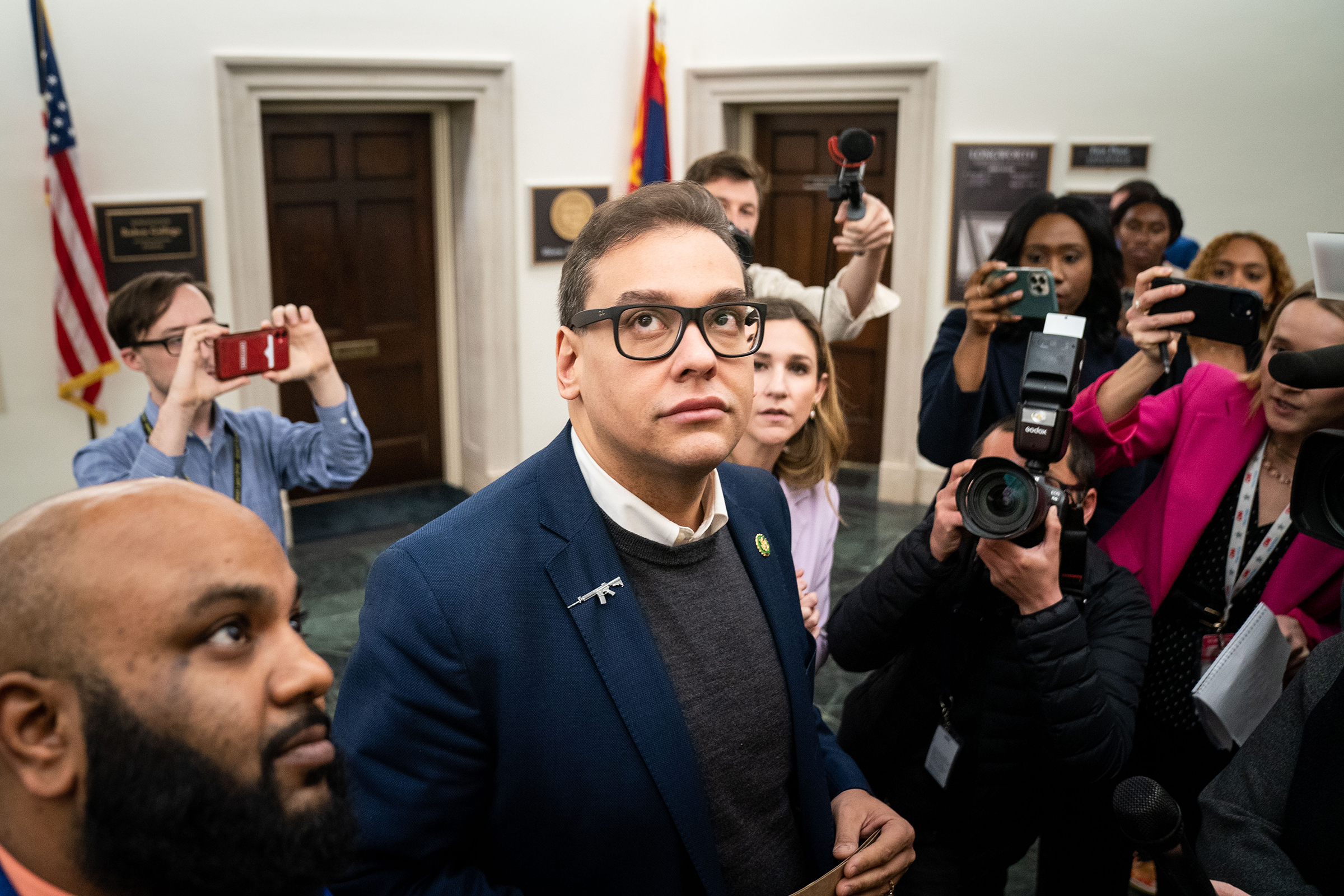 Reporters surround Rep. George Santos (R-NY) as he heads to the House Chamber for a vote on Tuesday, Jan. 31, 2023 in Washington, DC. (Kent Nishimura—Los Angeles Times/Getty Images)
