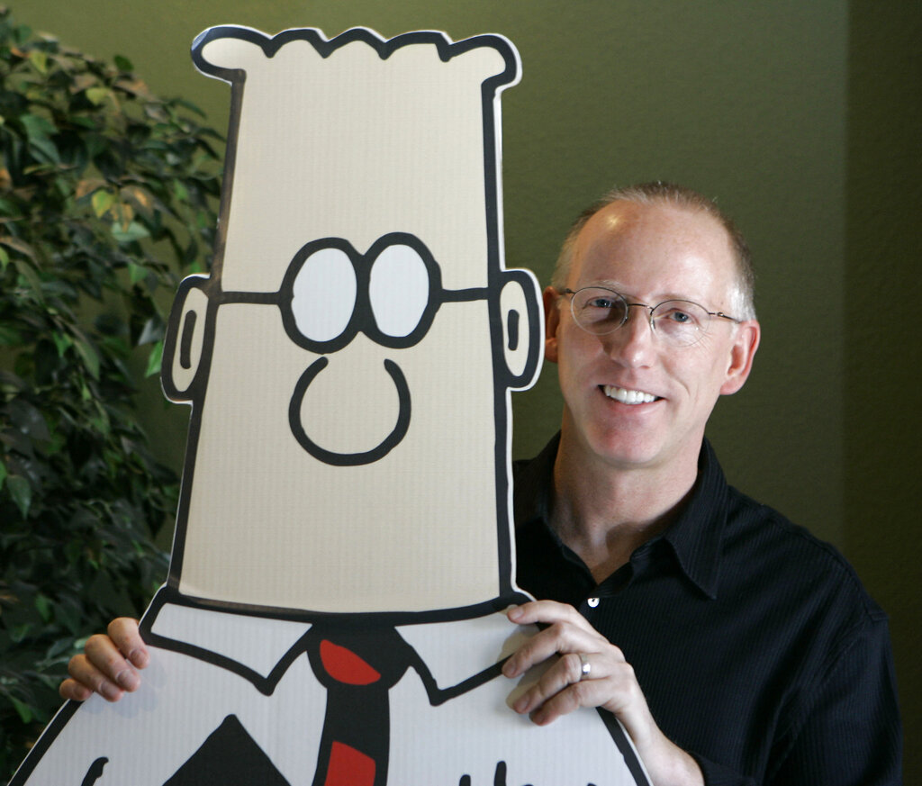 Scott Adams, creator of the comic strip Dilbert, poses for a portrait with the Dilbert character in his studio in Dublin, Calif., on Oct. 26, 2006. (Marcio Jose Sanchez—AP)