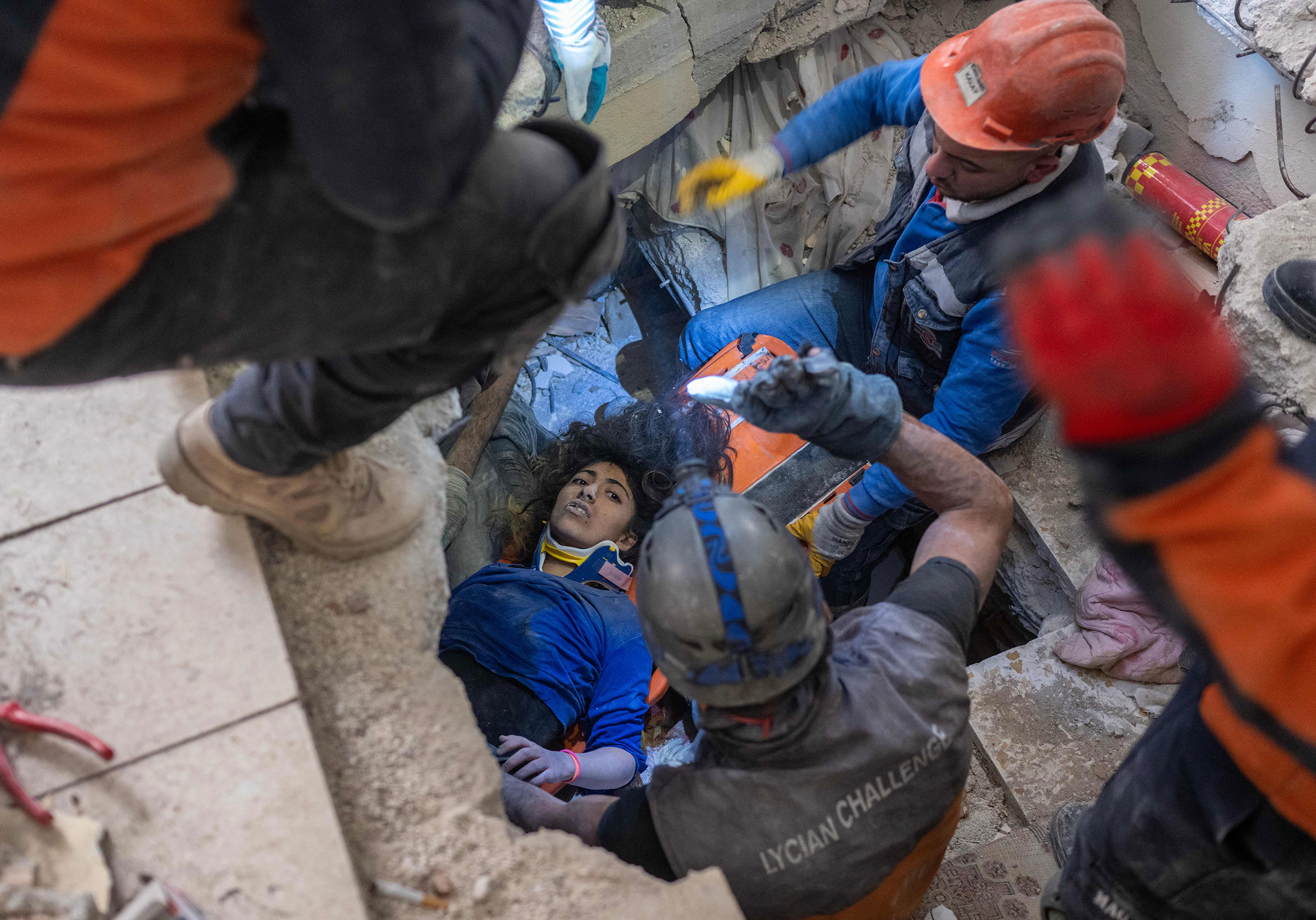 Emergency personnel conduct a rescue operation to save 16-year-old Melda from the rubble of a collapsed building in Hatay, southern Turkey, on Feb. 9, 2023, where she has been trapped since a 7.8-magnitude earthquake struck the country's south-east.