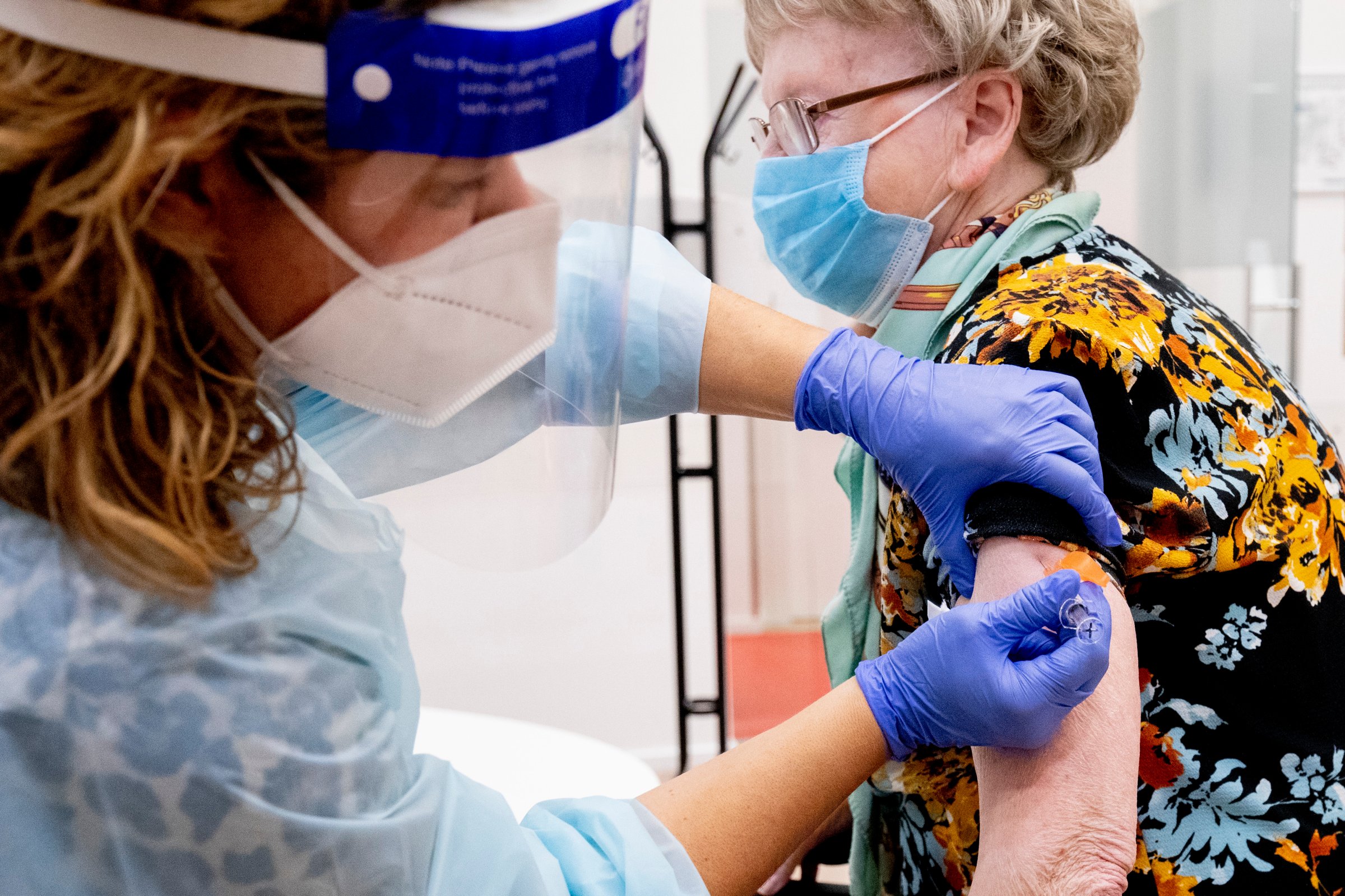 A woman receives an influenza vaccine