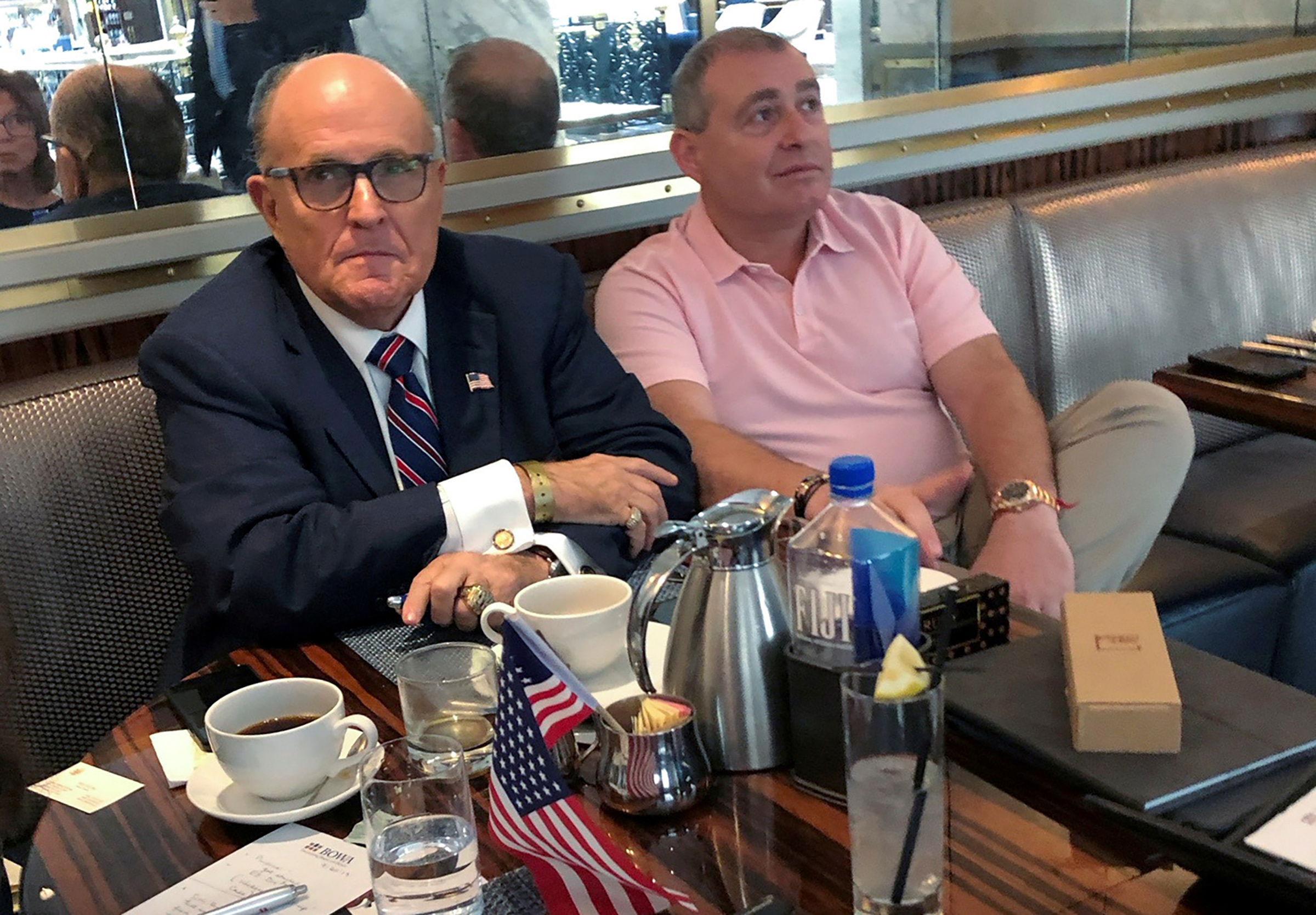 U.S. President Trump's personal lawyer Rudy Giuliani has coffee with Ukrainian-American businessman Lev Parnas at the Trump International Hotel in Washington, U.S., on Sept. 20, 2019. (Aram Roston—Reuters)