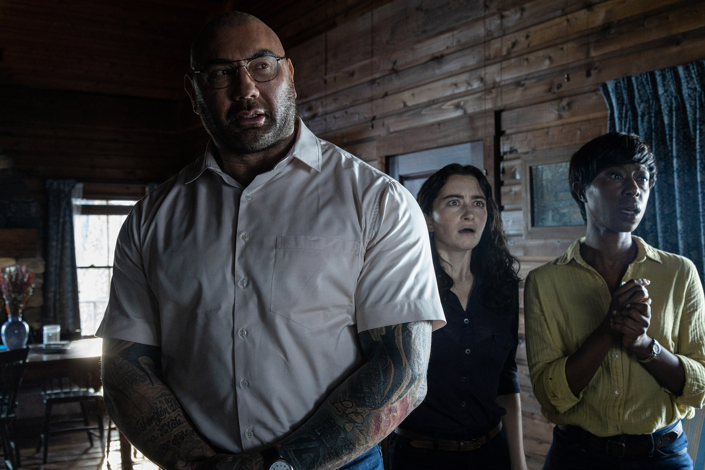 Dave Bautista, Abby Quinn and Nikki Amuka-Bird in <i>Knock At the Cabin</i>. (Courtesy Universal Pictures)