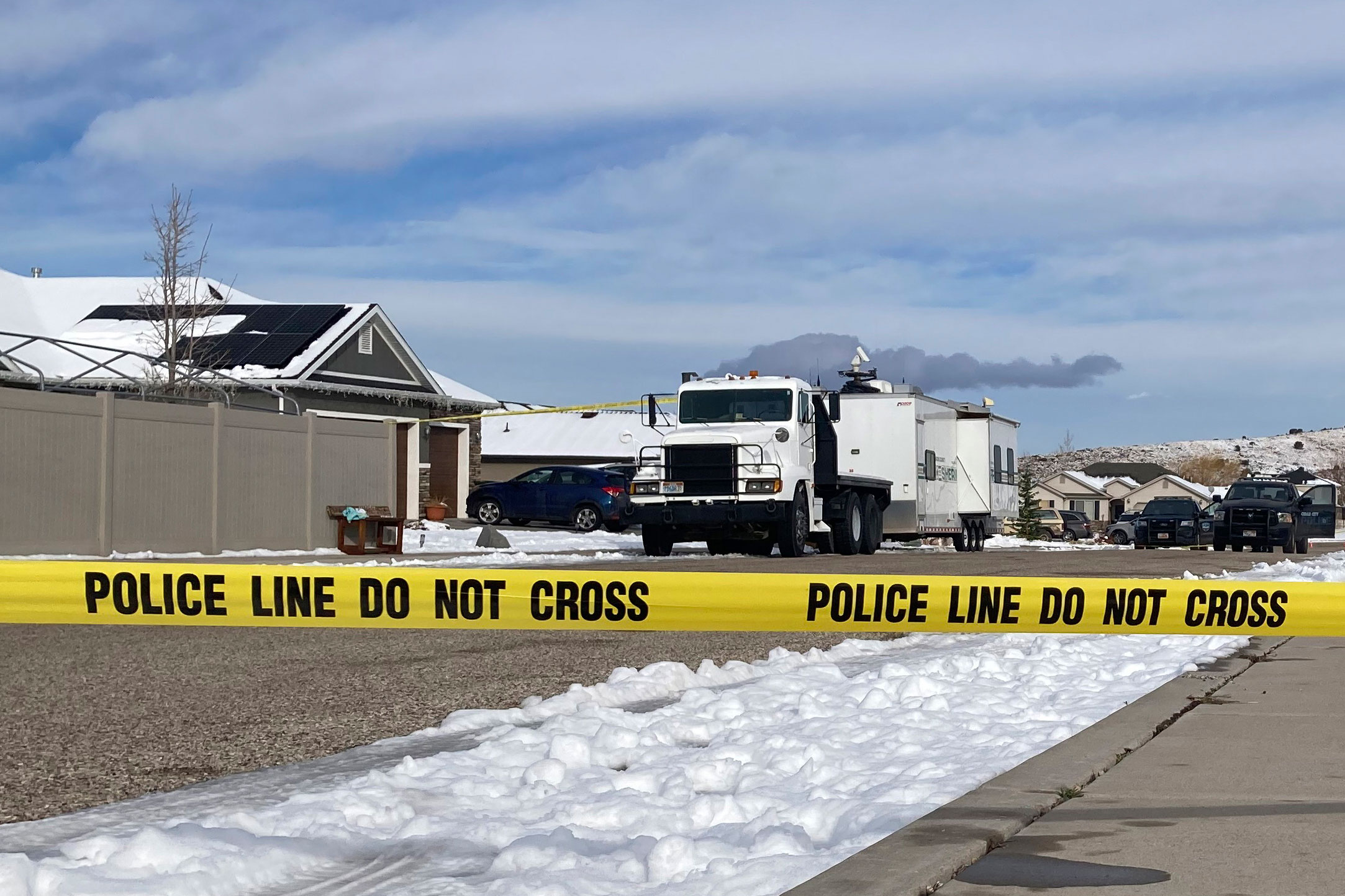 Police continue their investigation at a home where eight family members were found dead in Enoch, Utah, on Jan. 5, 2023. Officials said Michael Haight, 42, took his own life after killing his wife, mother-in-law and the couple's five children. (Sam Metz—AP)