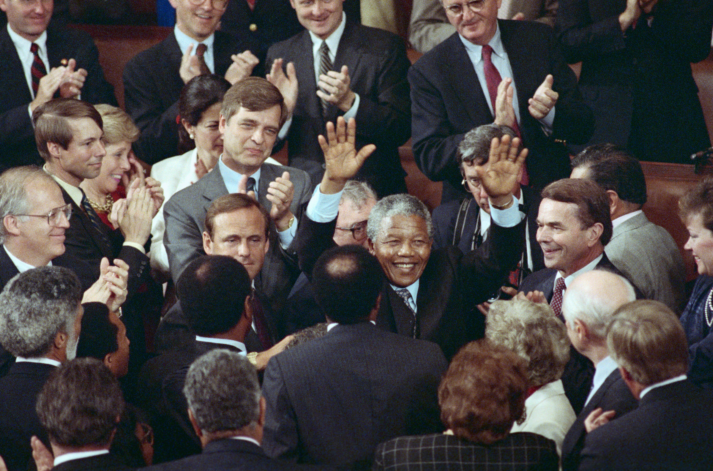 ANC leader Nelson Mandela raises his hands in response to a bipartisan standing ovation at the completion of his address to a joint meeting of Congress. (Bettmann Archive/Getty Images)