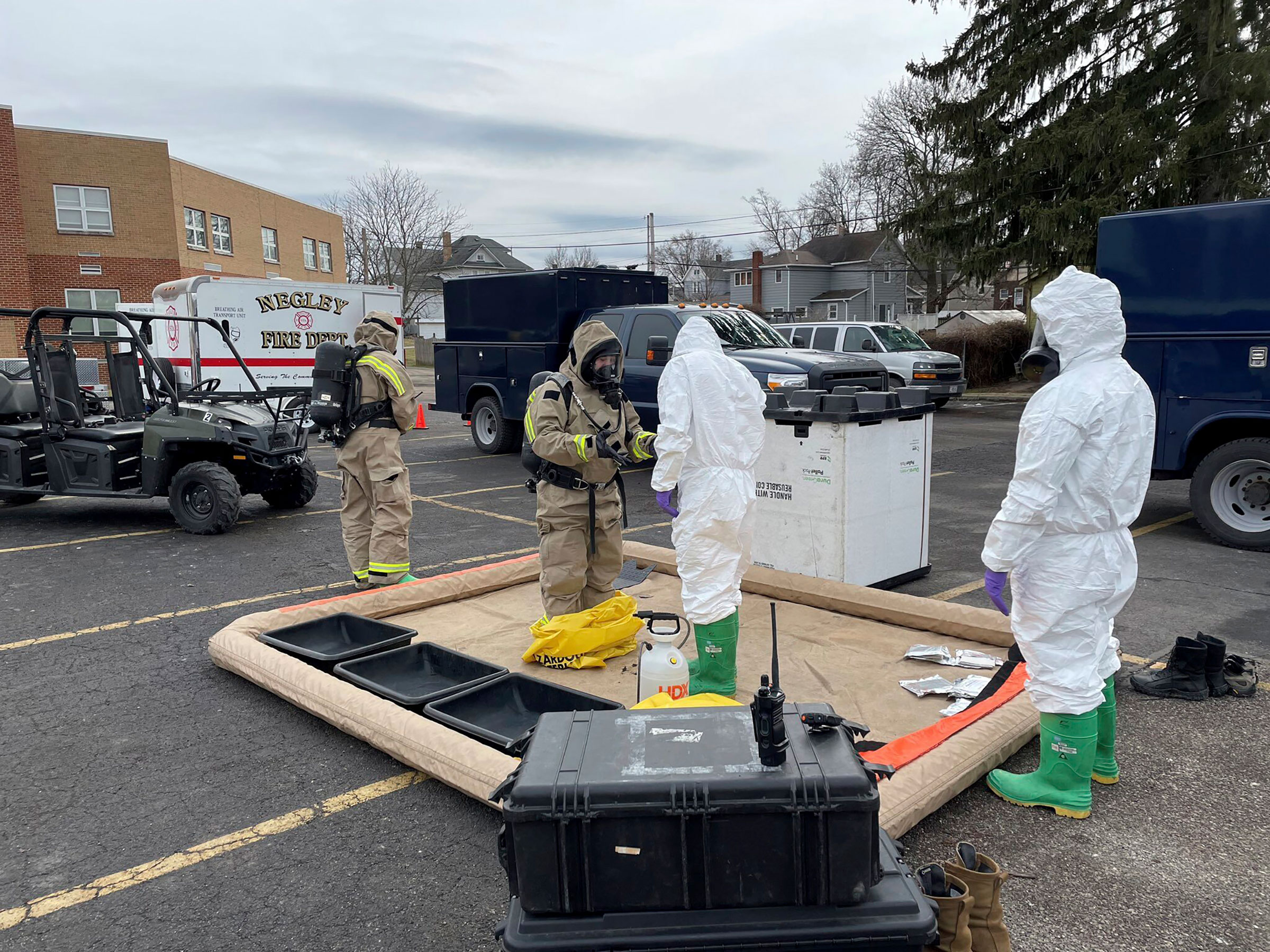 This photo provided by the Ohio National Guard, ONG 52nd Civil Support Team members prepare to enter an incident area to assess remaining hazards with a lightweight inflatable decontamination system (LIDS) in East Palestine, Ohio, on Feb. 7, 2023. (Ohio National Guard/AP)