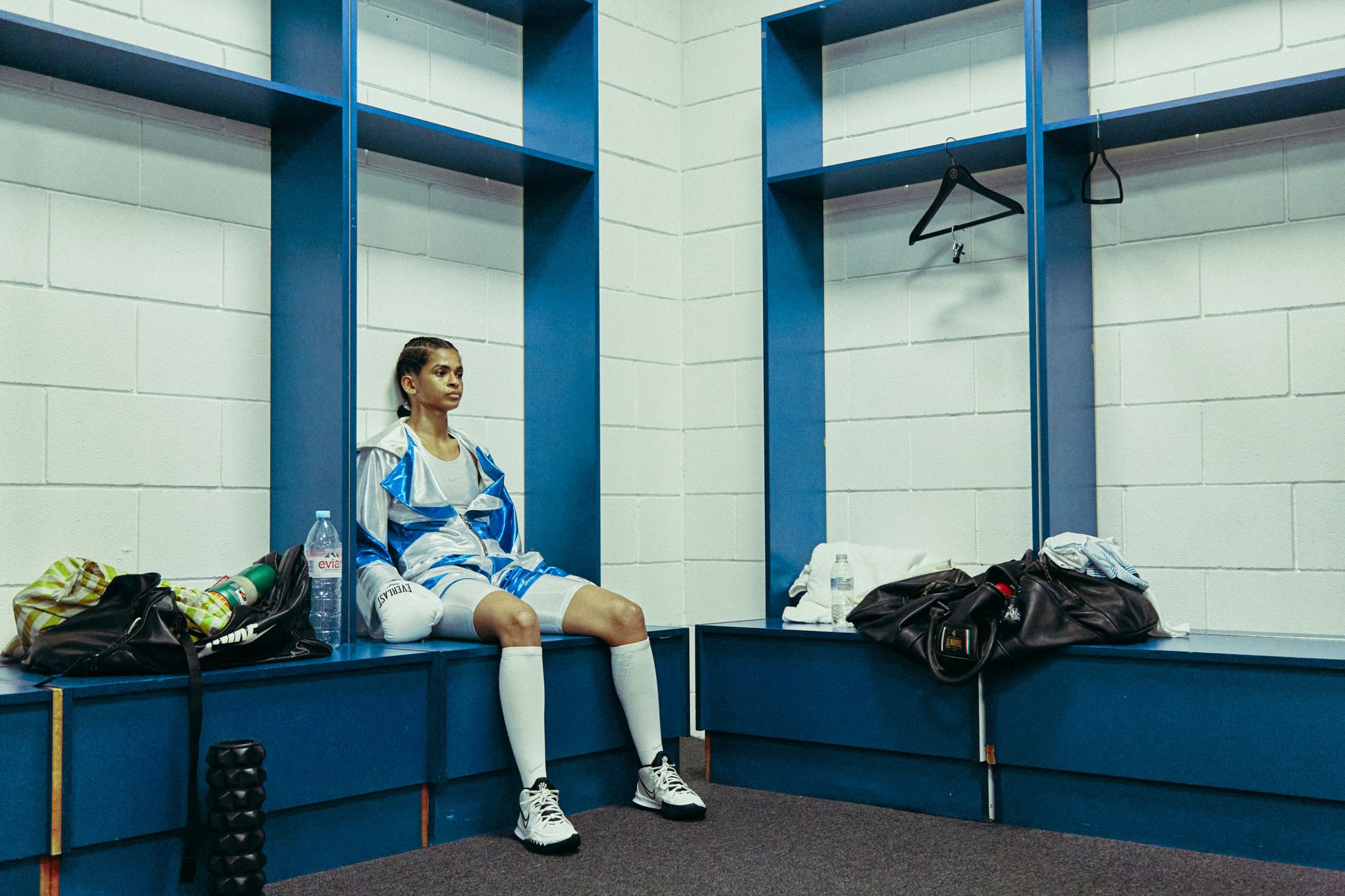 Ramla Ali seated in a locker room on fight night