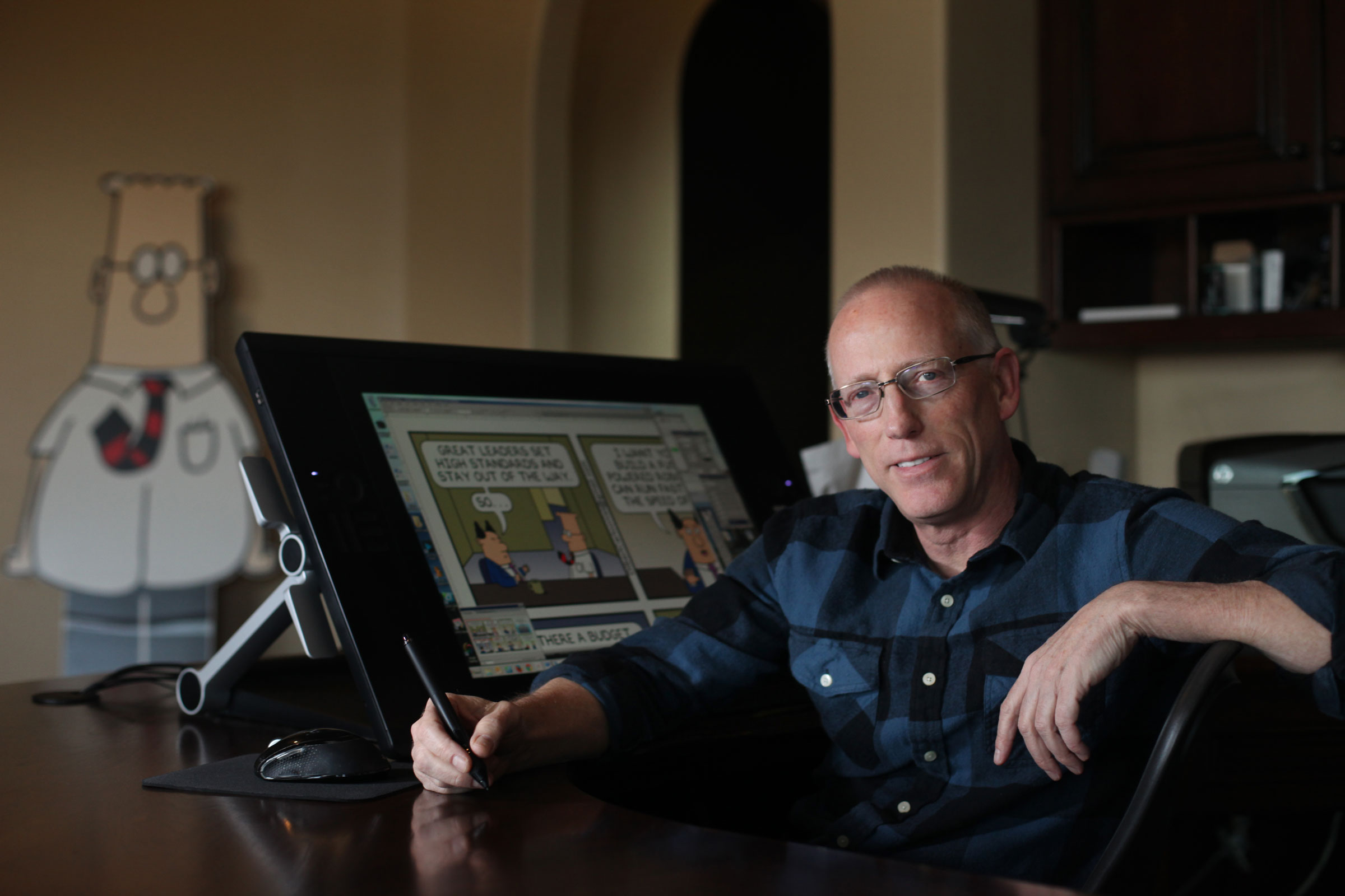Scott Adams, cartoonist and author and creator of “Dilbert,” poses for a portrait in his home office in Pleasanton, Calif., on Jan. 6, 2014. (Lea Suzuki—The San Francisco Chronicle/Getty Images)