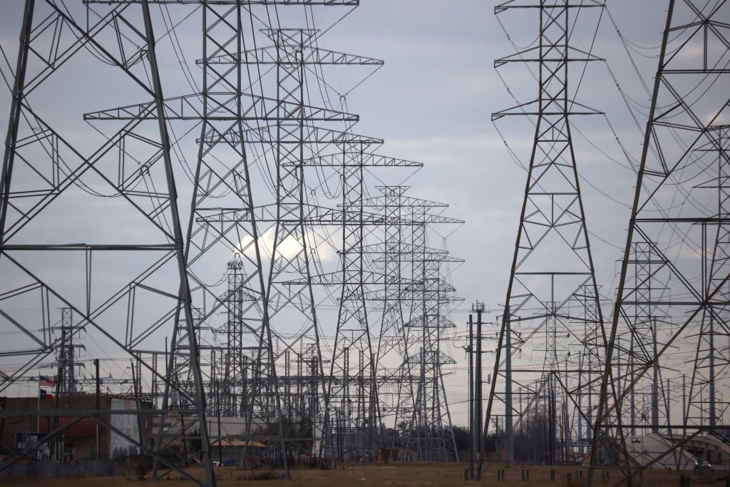 A view of high voltage transmission towers on Feb. 21, 2021 in Houston, Texas. Millions of Texans lost power when winter storm Uri hit the state and knocked out coal, natural gas. and nuclear plants that were unprepared for the freezing temperatures brought on by the storm. (Justin Sullivan—Getty Images)