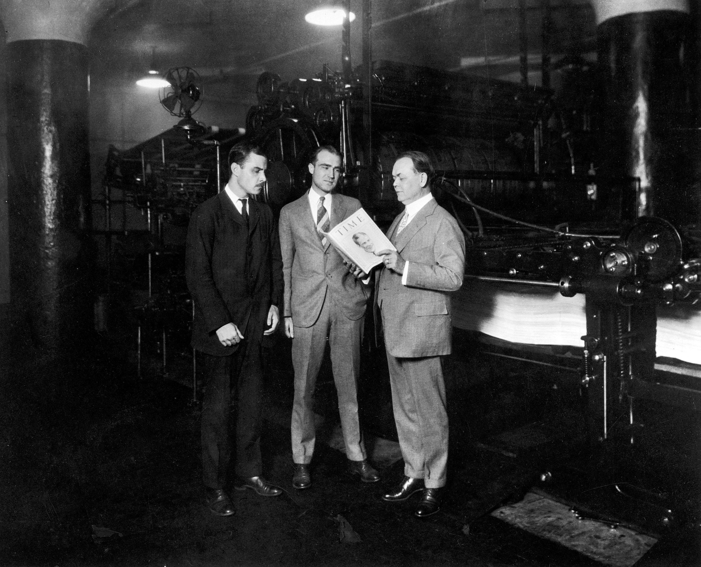 TIME co-founders Briton Hadden (left) and Henry Luce (center) with politician and Cleveland city manager William R. Hopkins, in Cleveland on Aug. 31, 1925 (The LIFE Picture Collection/Shutterstock)