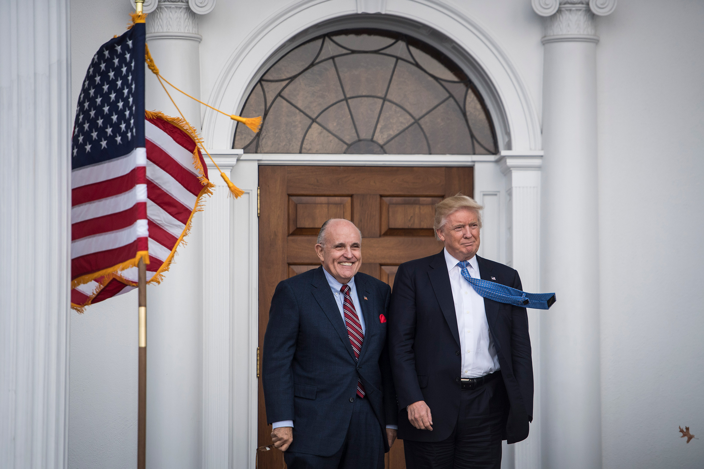 Former President Donald Trump greets Rudy Giuliani at the clubhouse at Trump National Golf Club Bedminster in Bedminster Township, N.J. on Nov. 20, 2016. (Jabin Botsford—The Washington Post/Getty Images)