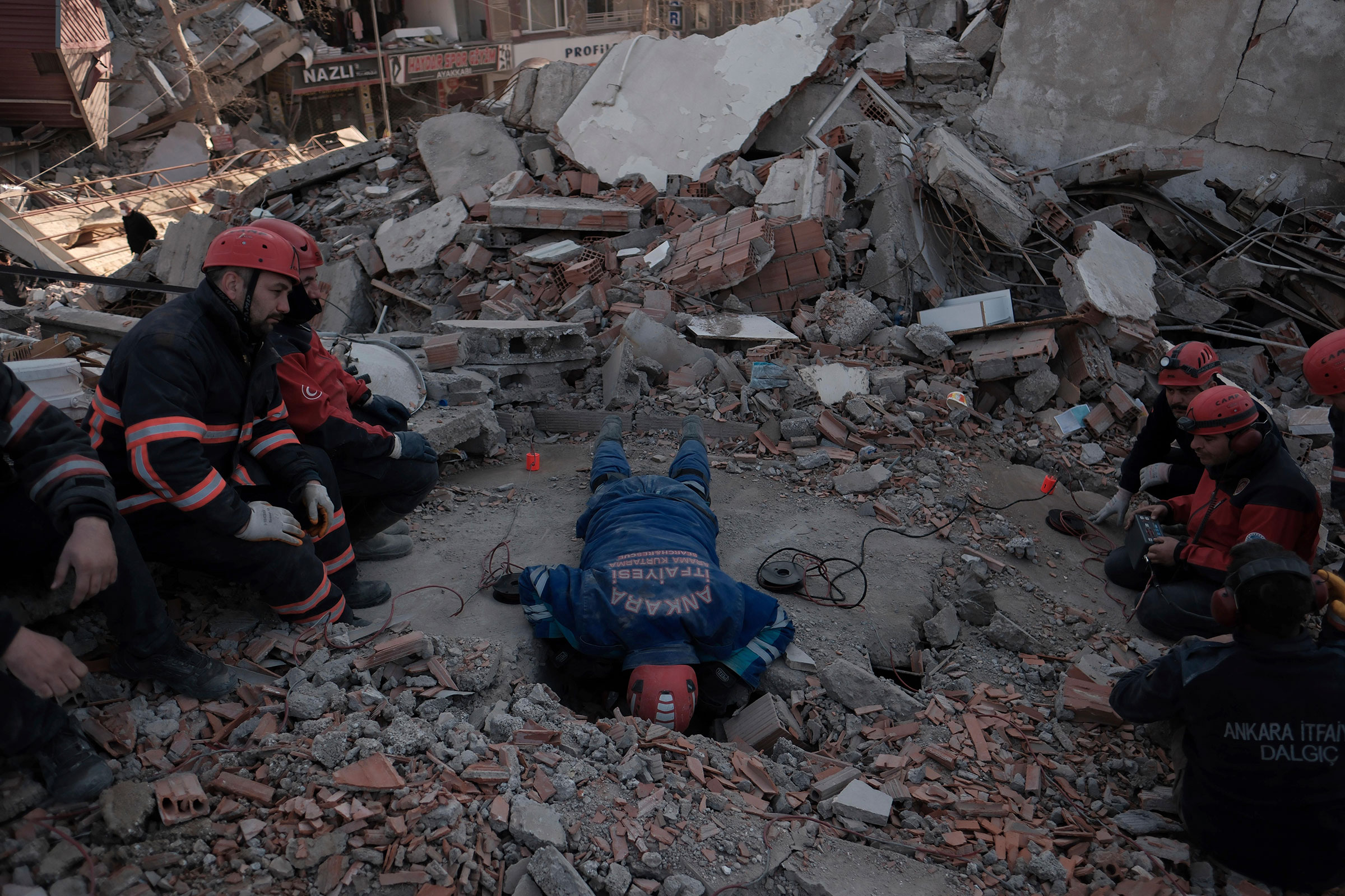 A rescue staff calls out at a collapsed building in Kahramanmaraş in southernmost Turkey on Feb. 12, 2023. (Yomiuri Shimbun—AP)