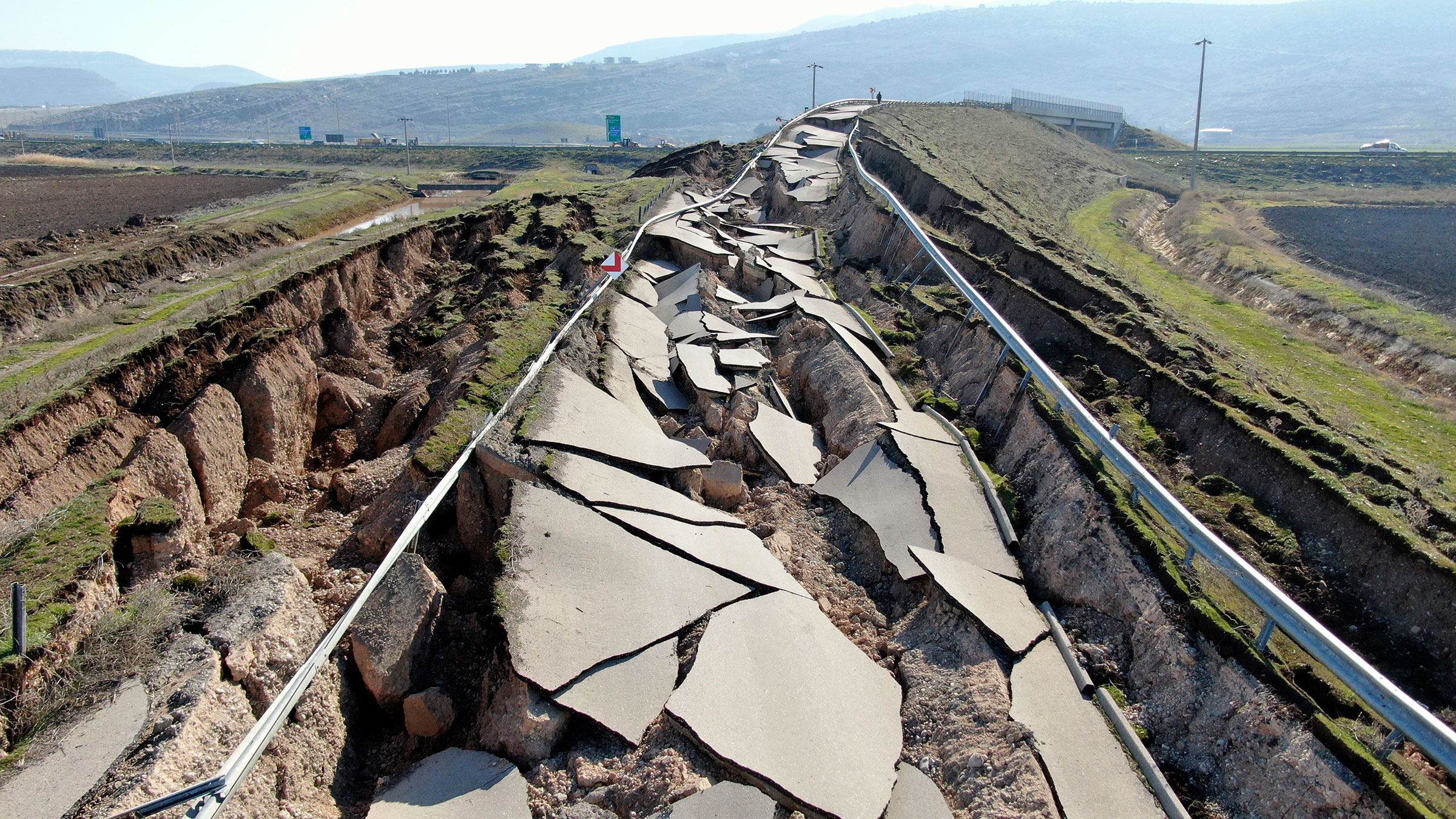 Cracks along the road near Koseli village in Pazarcik, Kahramanmaras, southern Turkey, on Feb. 12, 2023. (IHA/AP)