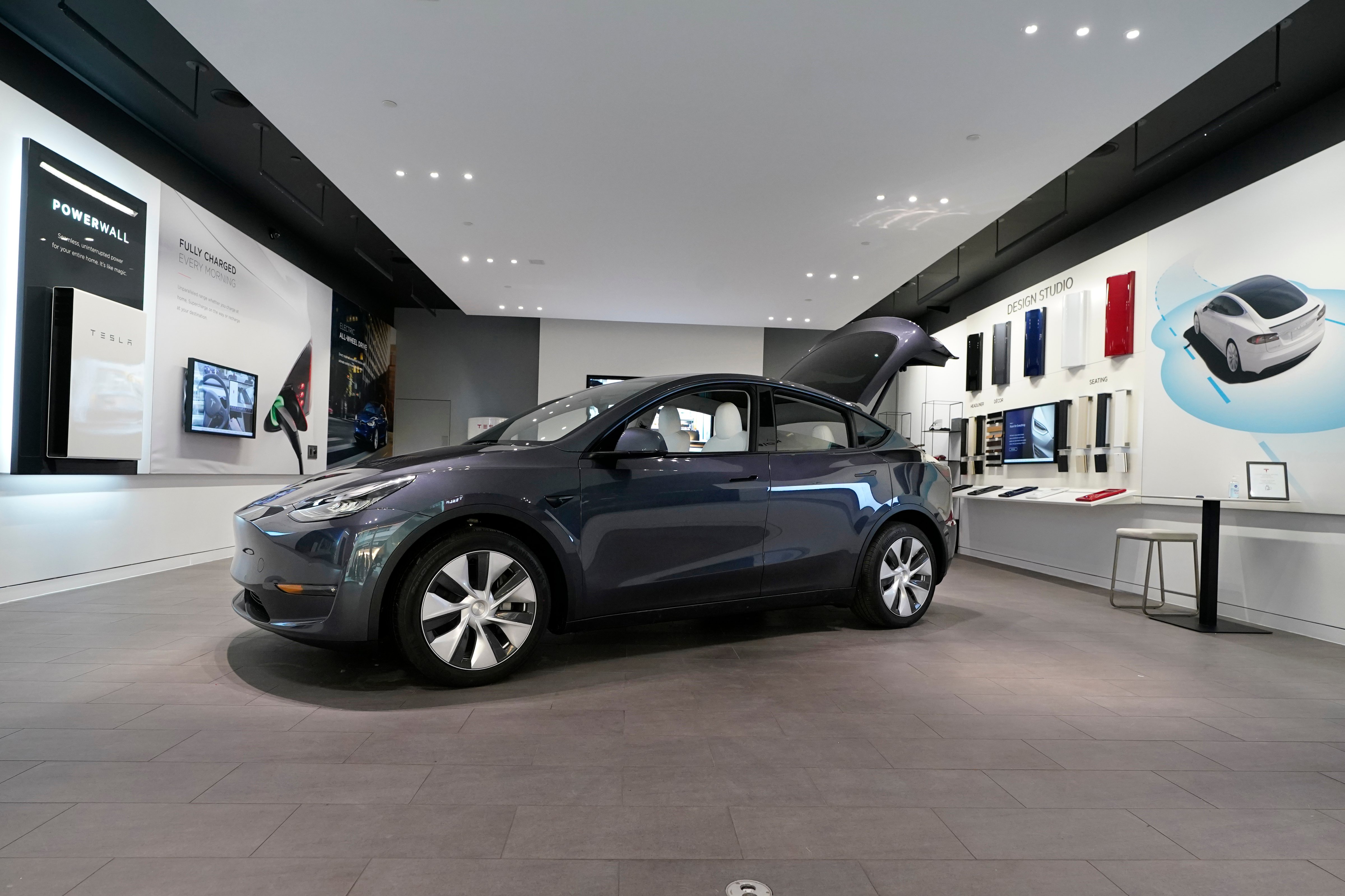 A Tesla Model Y Long Range is displayed on Feb. 24, 2021, at the Tesla Gallery in Troy, Mich. U.S. auto safety regulators have opened an investigation into Tesla’s Model Y SUV after getting two complaints that the steering wheels can come off while being driven. (AP Photo/Carlos Osorio, File)