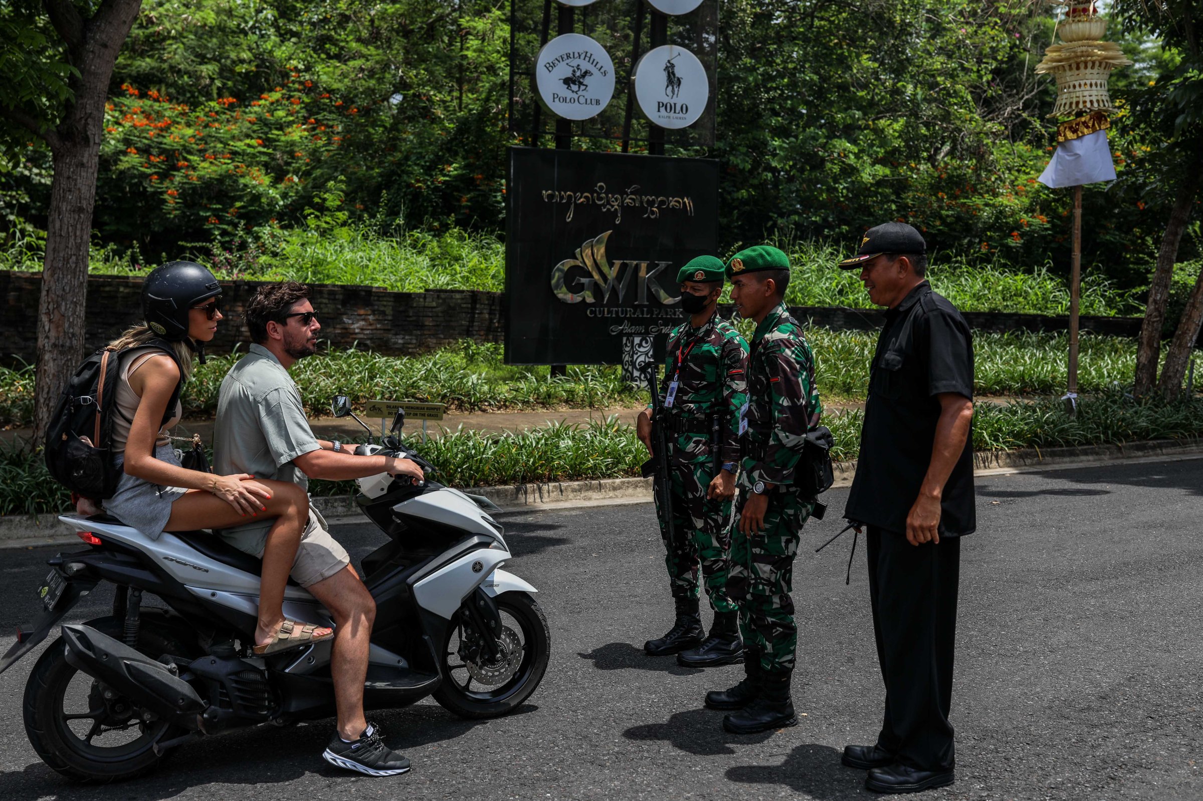 Bali police stop tourists on a motorbike