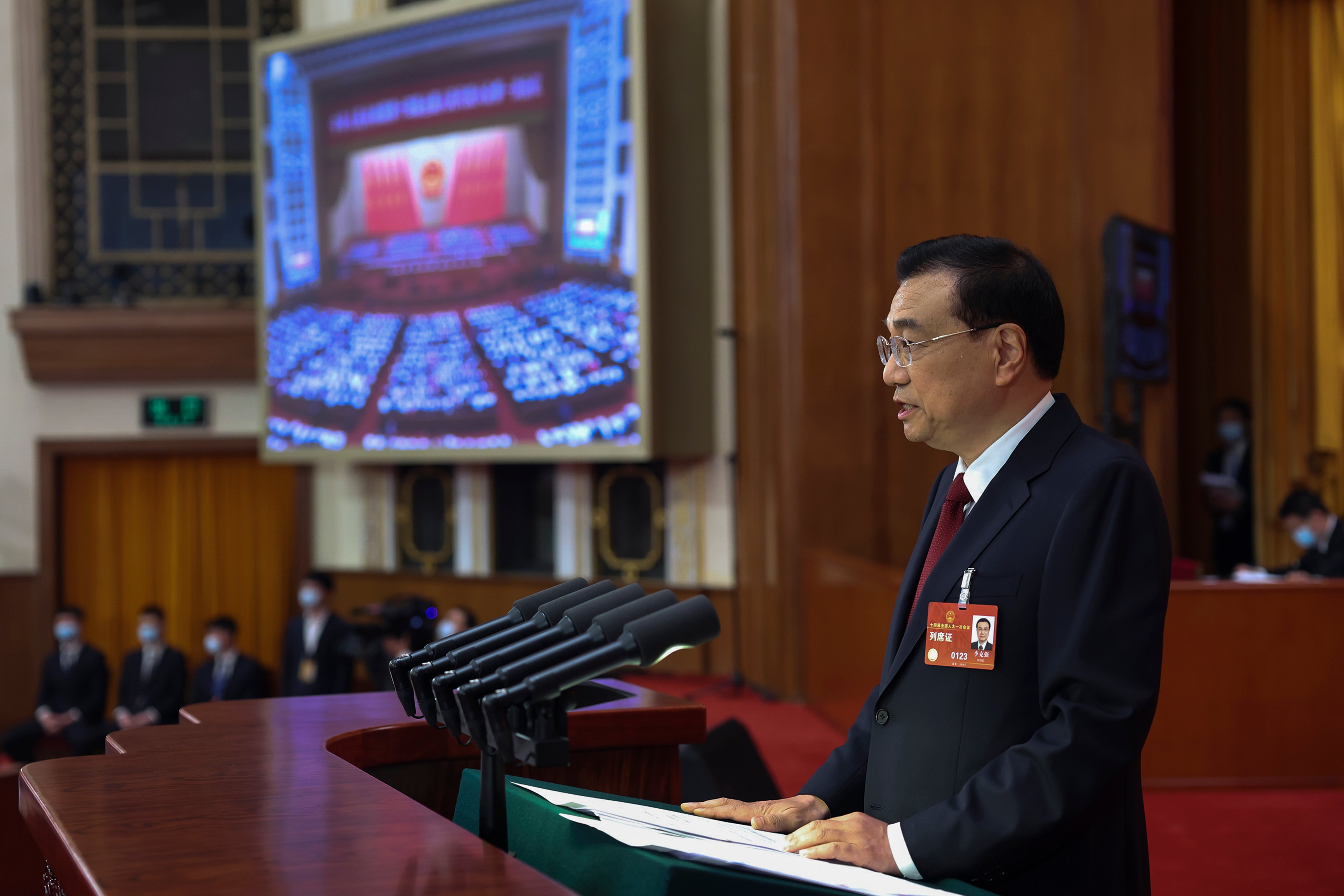 Chinese Premier Li Keqiang delivers a government work report during the opening session of China's National People's Congress at the Great Hall of the People in Beijing, Sunday, March 5, 2023. (Ju Peng—Xinhua News Agency/AP)