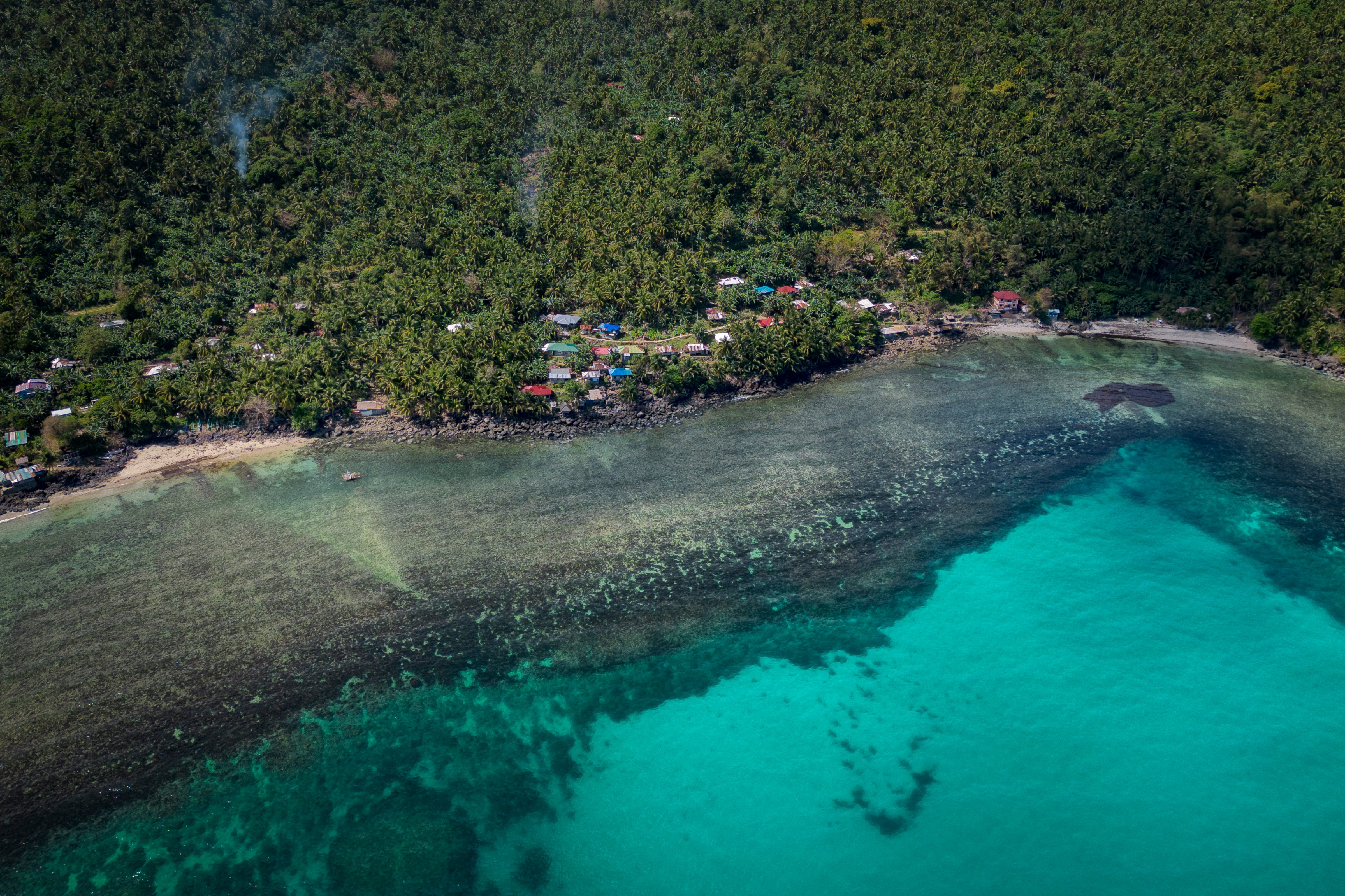 An aerial view of oil slick from the sunken tanker MT Princess Empress along a shoreline, March 08, 2023. (Ezra Acayan—Getty Images)