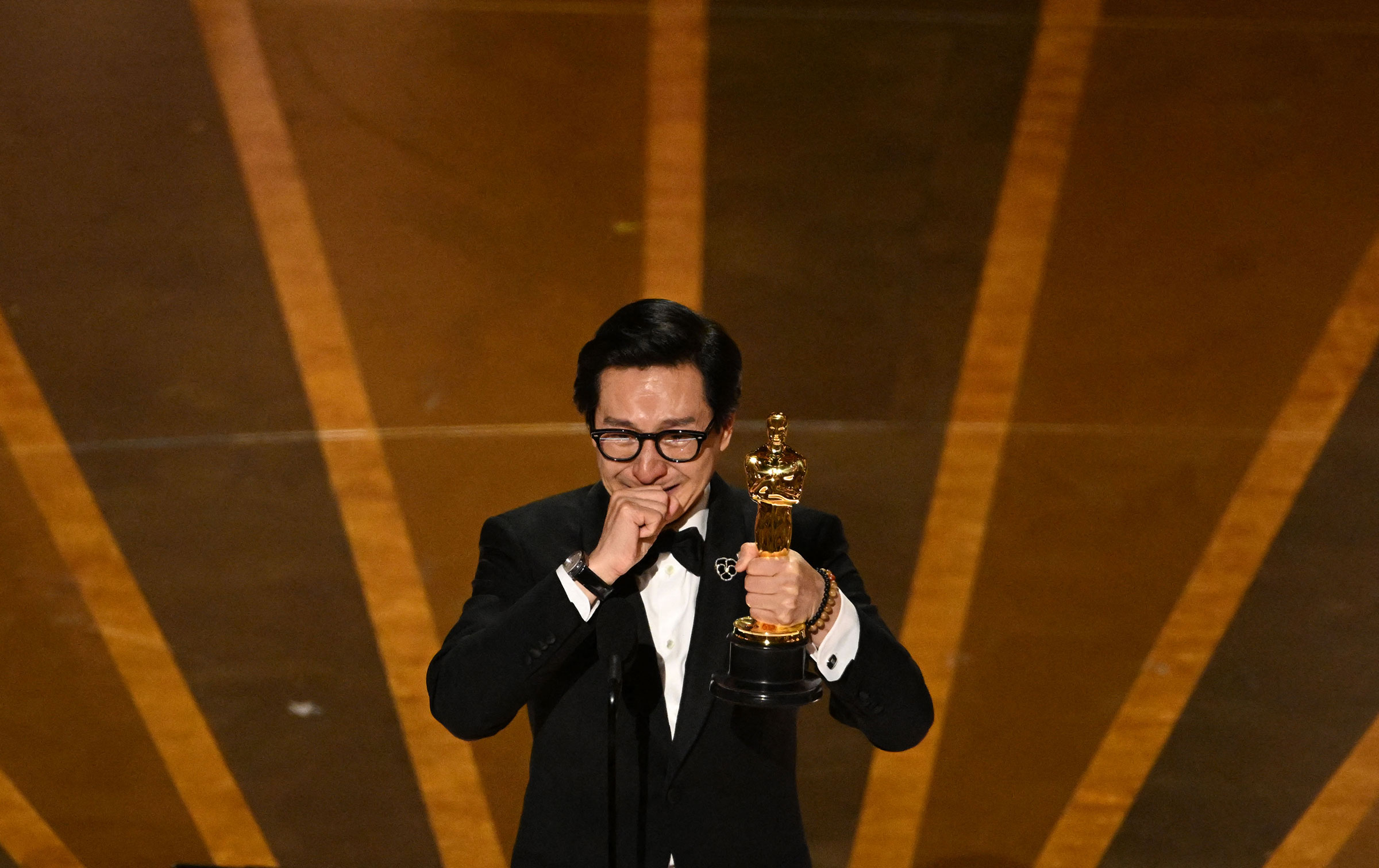 Ke Huy Quan accepts the Oscar for Best Actor in a Supporting Role for "Everything Everywhere All at Once" onstage during the 95th Annual Academy Awards.