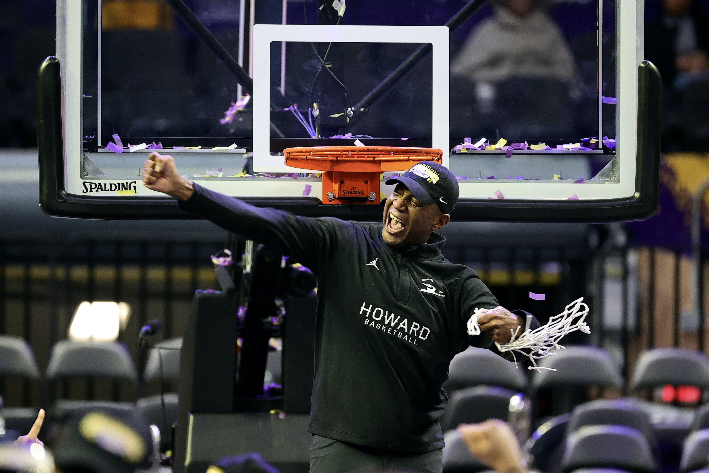 Head coach Kenny Blakeney of the Howard Bison celebrates with the net after defeating the Norfolk State Spartans to win the 2023 MEAC Men's Basketball Tournament Championship at Norfolk Scope Arena on March 11, 2023 in Norfolk, Virginia. (Tim Nwachukwu—Getty Images)