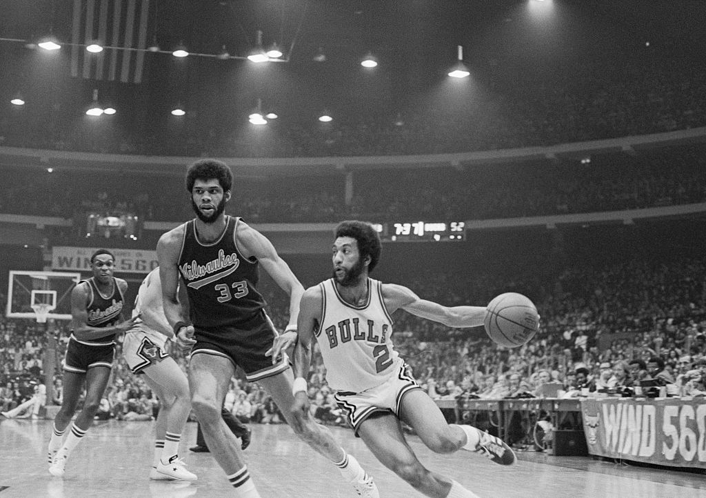 Chicago Bulls guard Norm Van Lier drives past Milwaukee Bucks center Kareem Abdul-Jabbar during Game 2 of the NBA Playoffs at the United Center in Chicago on April 19, 1974. (Bettmann Archive/ Getty Images)