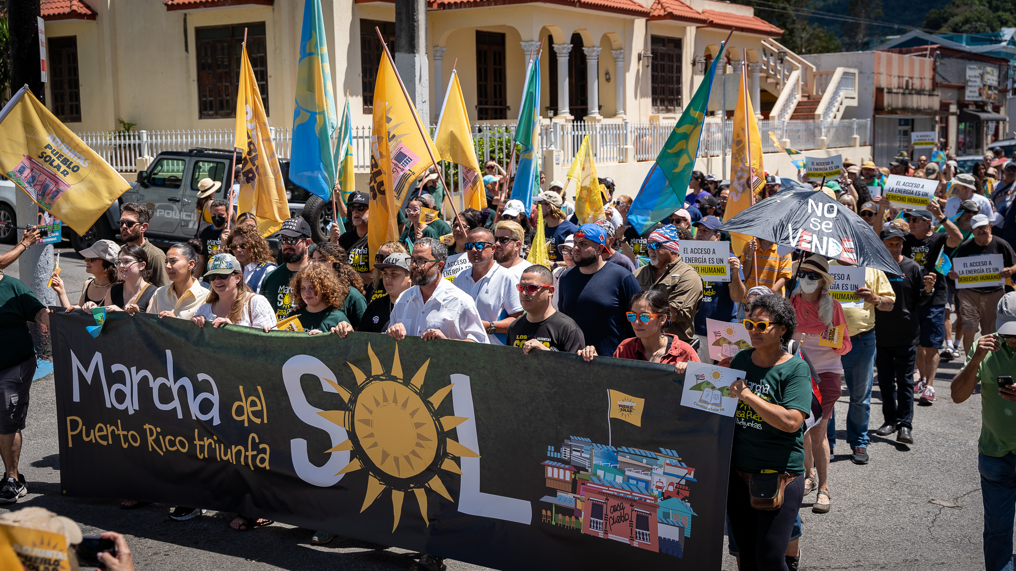 Residents in Adjuntas, Puerto Rico, celebrate the launch of a community-owned solar microgrid on March 18, 2023. (Peter Walle, Honnold Foundation)