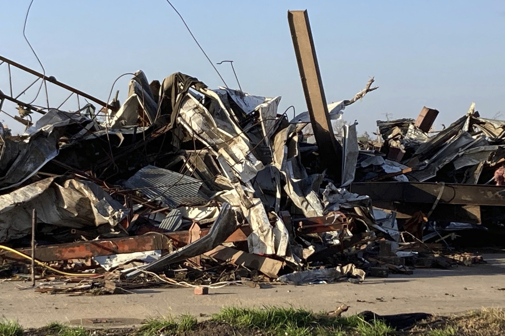Debris covers a damaged structure in Rolling Fork, Miss, on March 25, 2023. (AP Photo—Rogelio Solis)