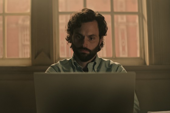 Joe Goldberg looking at his laptop