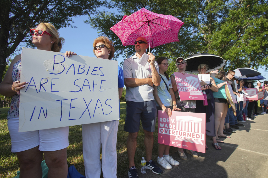 Linda Banes, left, and Ethelene Marshall stand with anti-abortion demonstrators as they gathered to sing and pray outside Planned Parenthood in Houston, Texas on June, 24, 2022. (Brett Coomer—Houston Chronicle/AP)