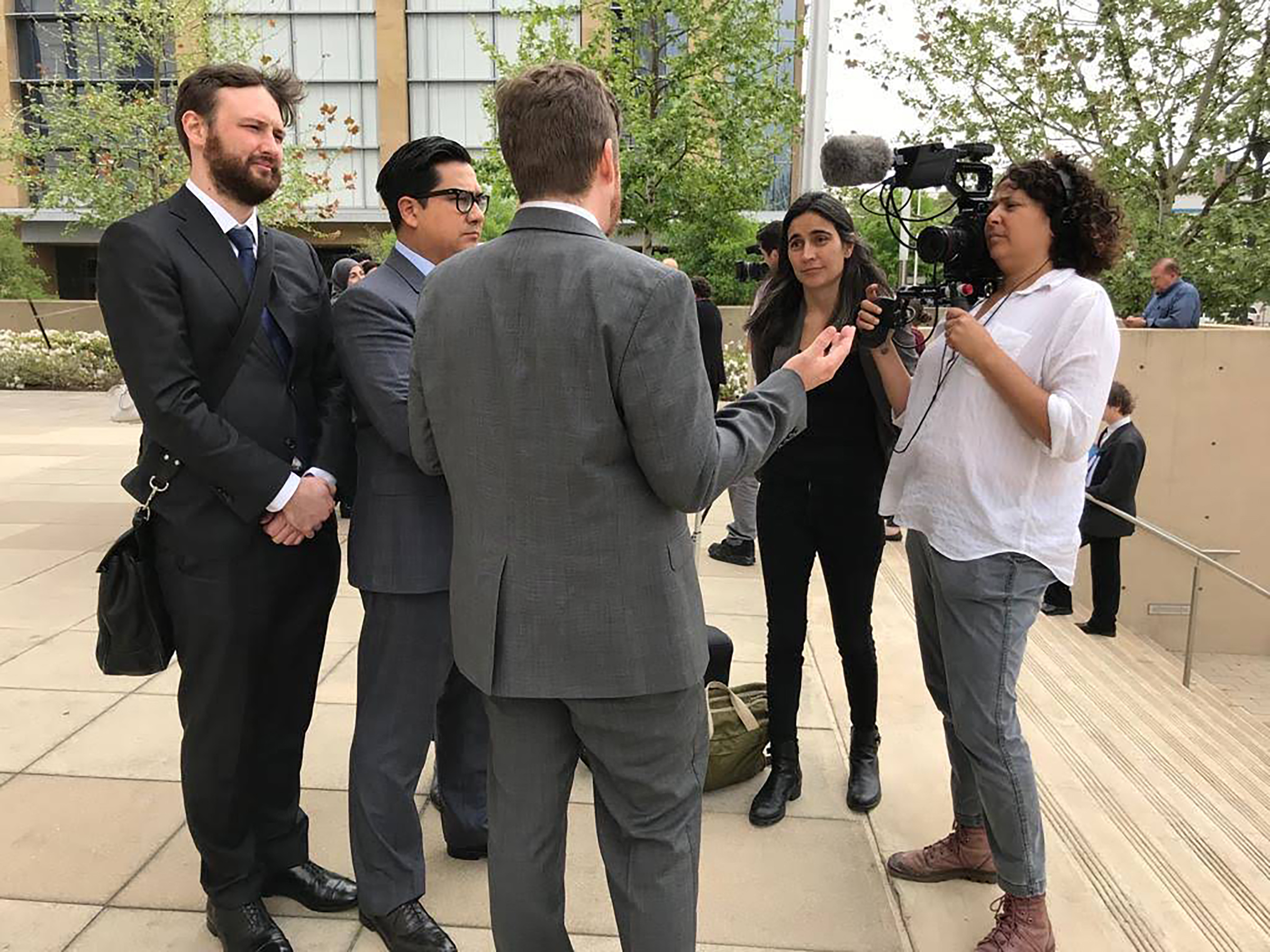 Julia Bacha and cinematographer Amber Fares interviewing ACLU lawyers outside the courtroom in Austin, Texas (Courtesy Just Vision)