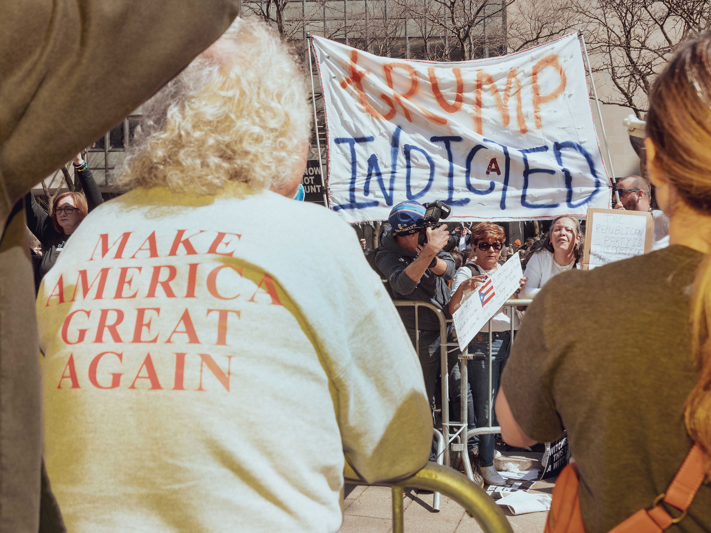 Supporters of former President Donald Trump and protestors during a rally outside criminal court in New York City, on April 4, 2023. (Ismail Ferdous—Bloomberg/Getty Images)