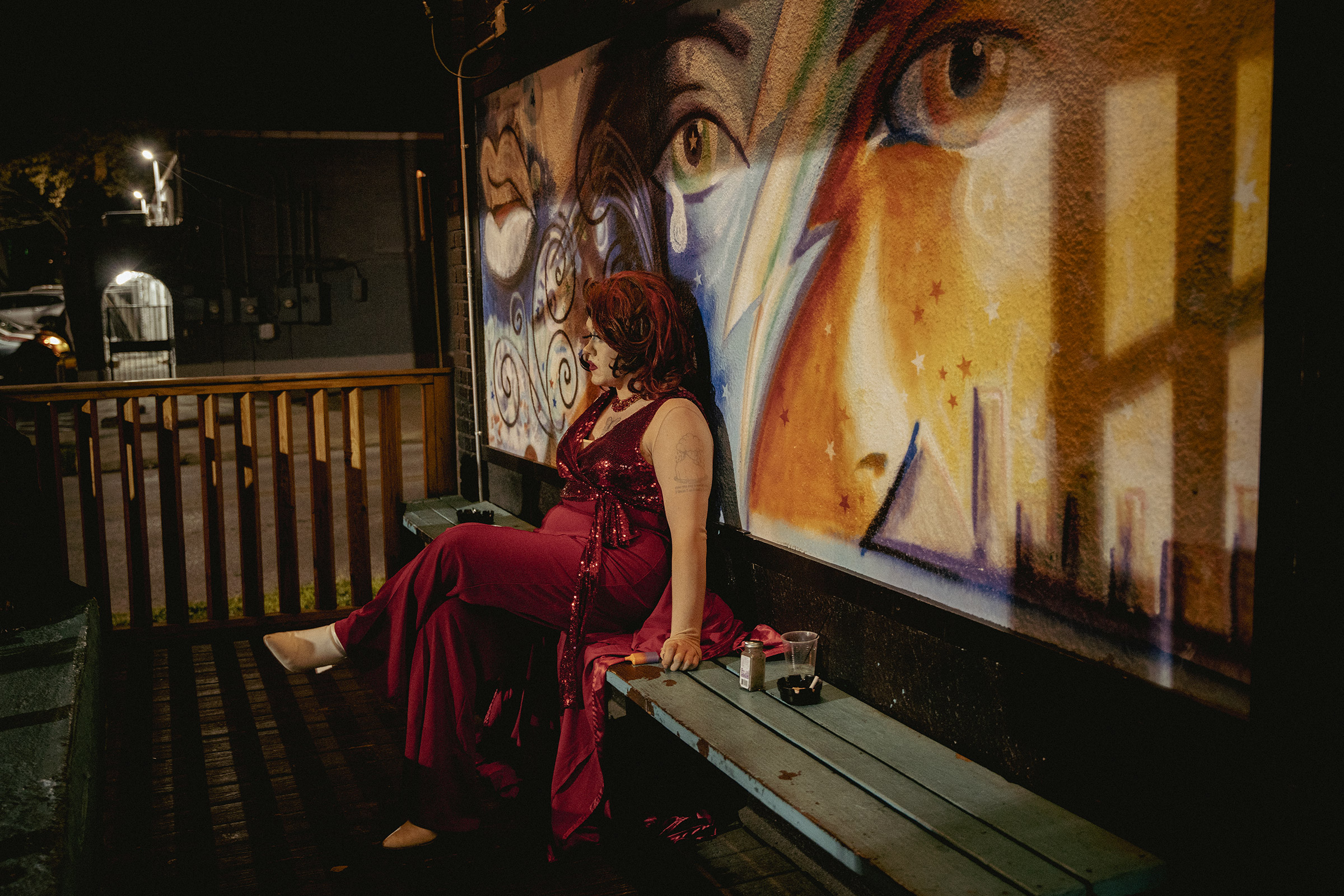 Tiffany Minxx, a drag performer in Memphis, sits on the back porch of Dru’s while taking a break from Sapphic Sunday.