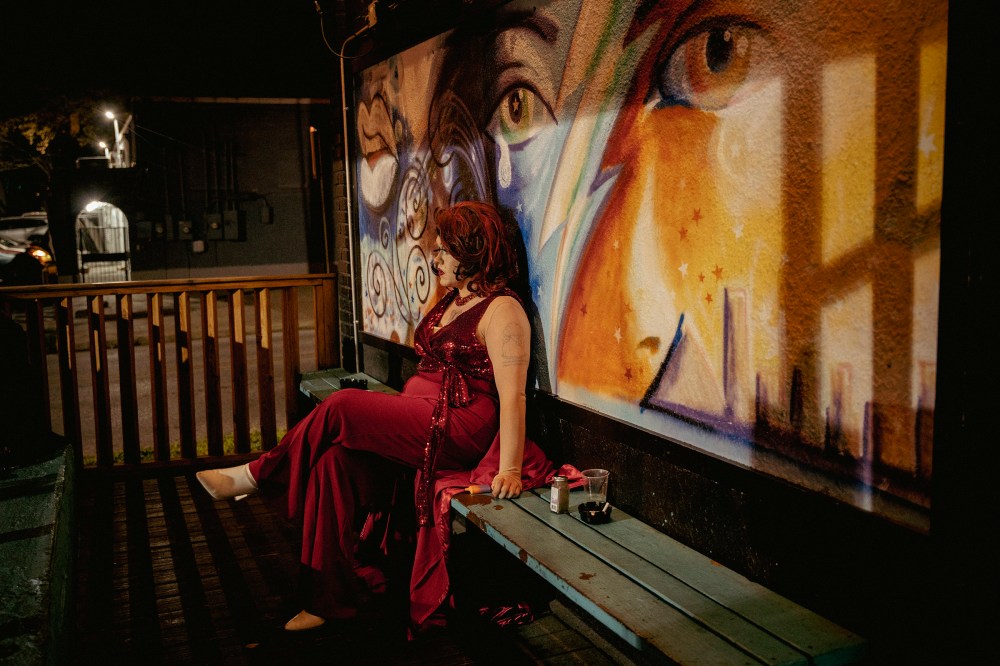 Tiffany Minxx, a drag performer in Memphis, sits on the back porch of Druâs while taking a break from Sapphic Sunday.