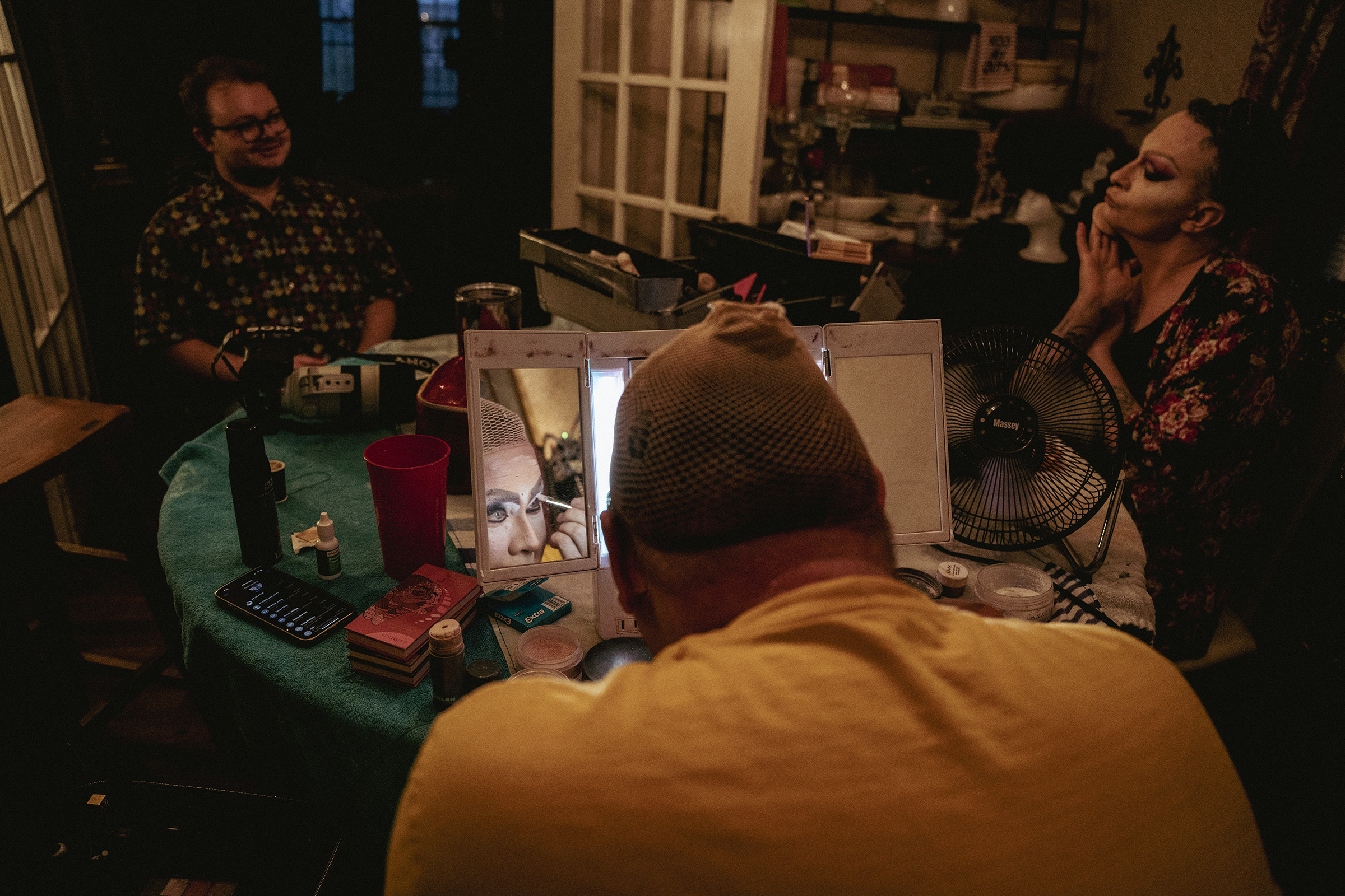Kelly McDaniel begins his transformation into his drag-queen persona, Keleigh Klarke, at home along with fellow performer Holly Walnutz (right) and Klarke’s drag daughter Stephanie Embark (left). (Andrea Morales for TIME)