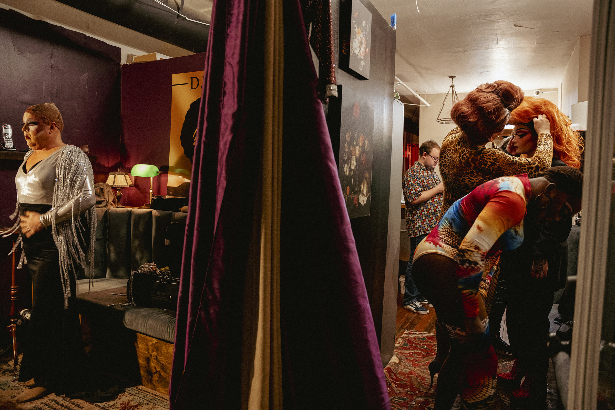 Keleigh Klarke (left) changes into her second look for the evening as other performers get into their own stage wear. (Andrea Morales for TIME)