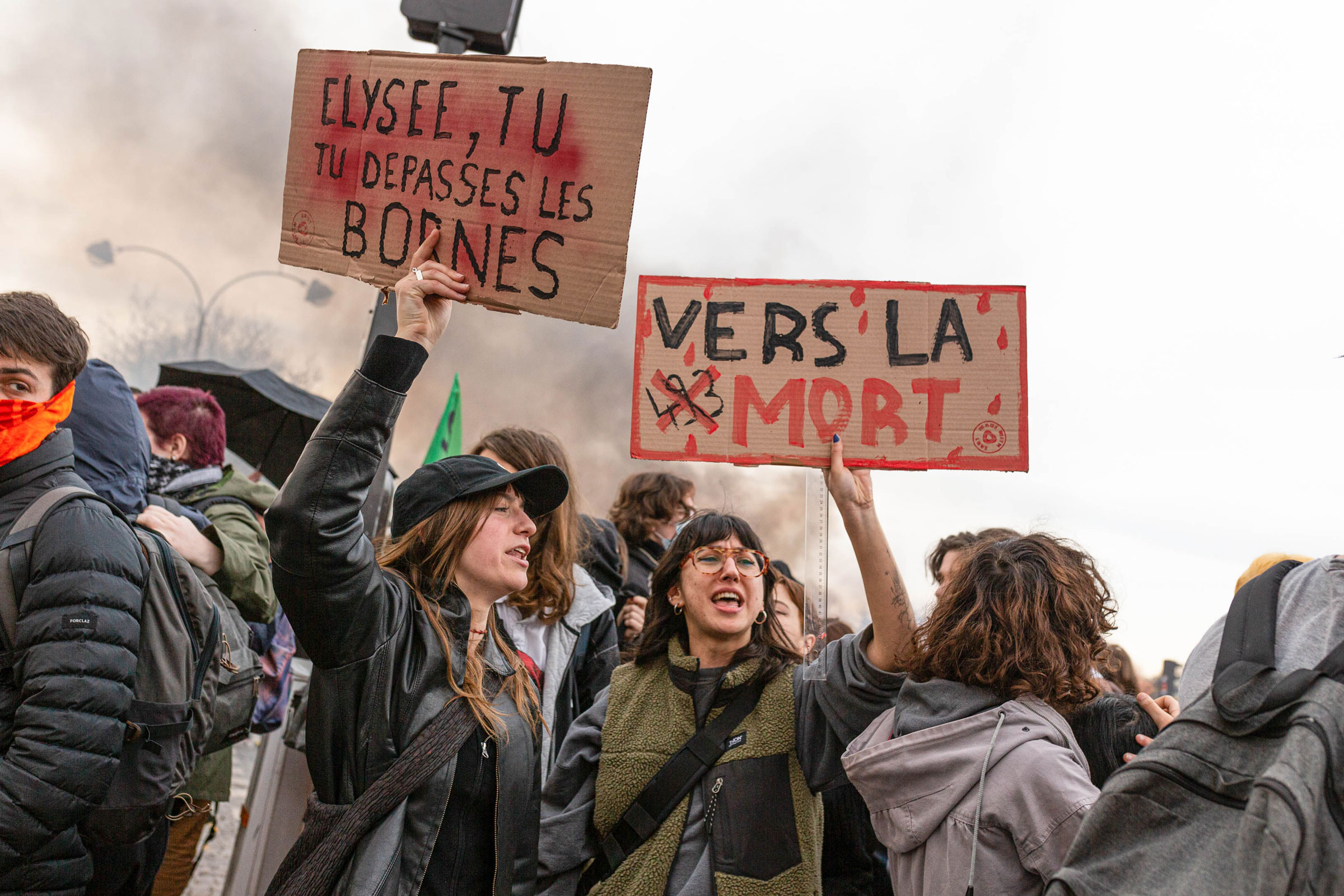 Protesters hold placards during a demonstration at the Place de la Concorde in Paris on March 16, 2023.