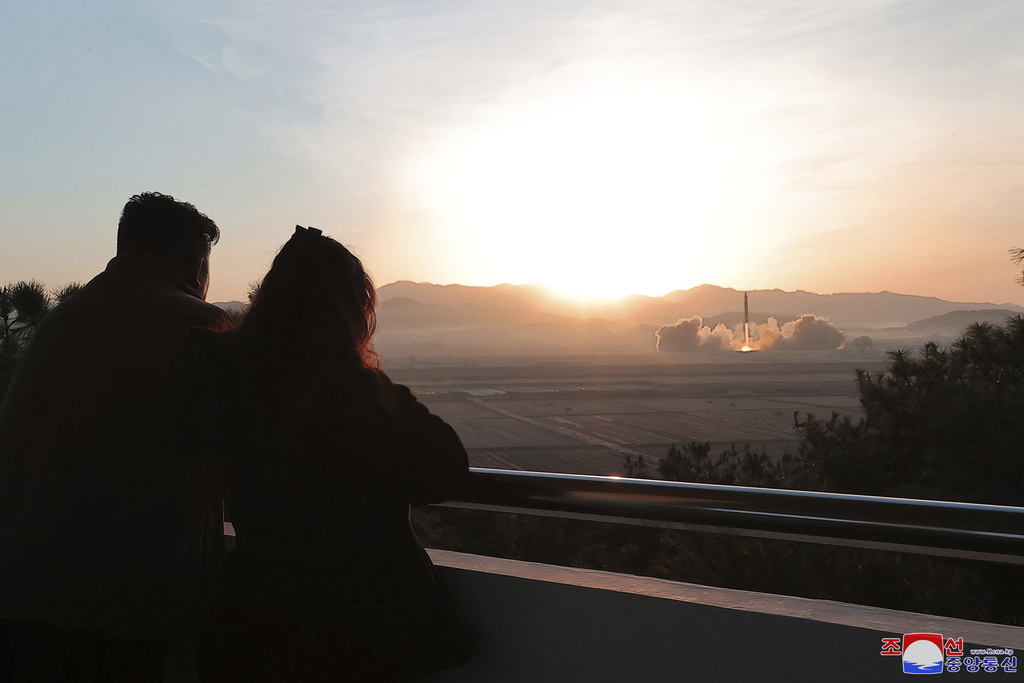 In this unverified photo provided by the North Korean government, Kim Jong Un watches a test launch of an intercontinental ballistic missile, with a young woman who appears to be his daughter, on March 16, 2023. (Korean Central News Agency/Korea News Service/AP)