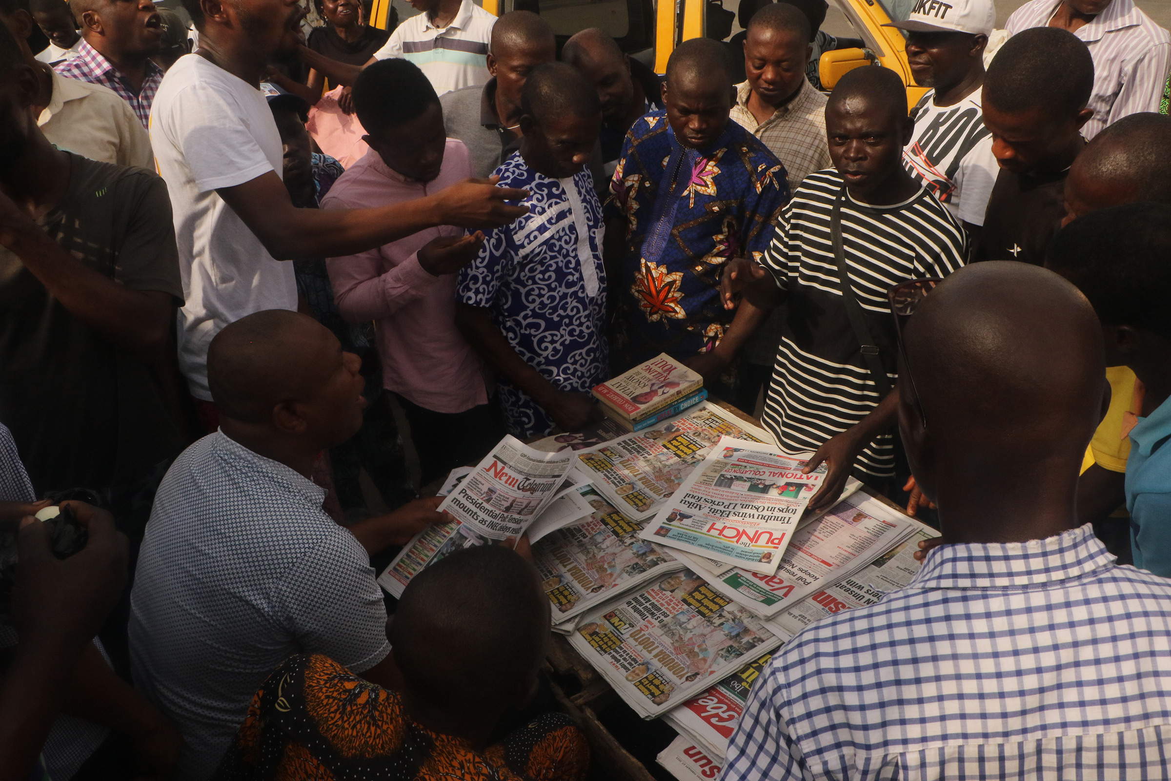 Nigerians in Lagos follow presidential election developments on Feb. 27. (Emmanuel Osodi—Anadolu Agency/Getty Images)