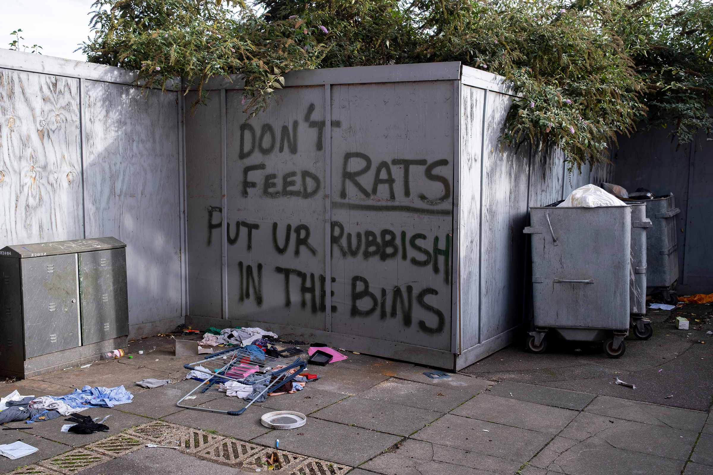 Local graffiti asking people to use the bins in their housing estate in Canning Town to avoid inadvertently feeding rats on Oct. 17, 2022 in London. (Mike Kemp—In Pictures/Getty Images)