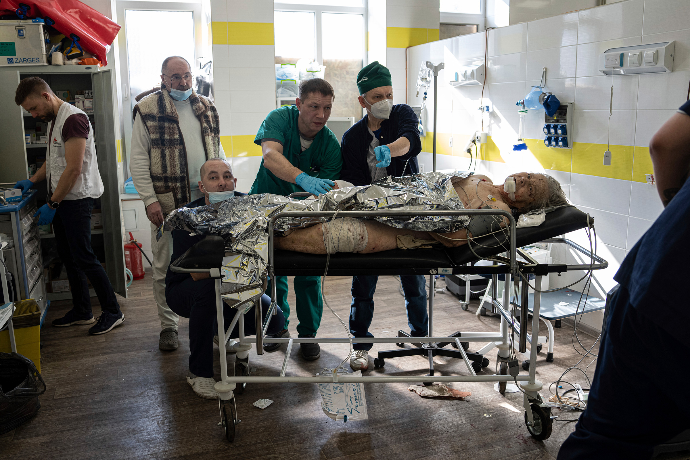 Doctors treat an injured local woman after shelling by Russian forces of residential neighbourhood at the hospital of Kostiantynivka, Ukraine, on March 10. (Evgeniy Maloletka—AP)