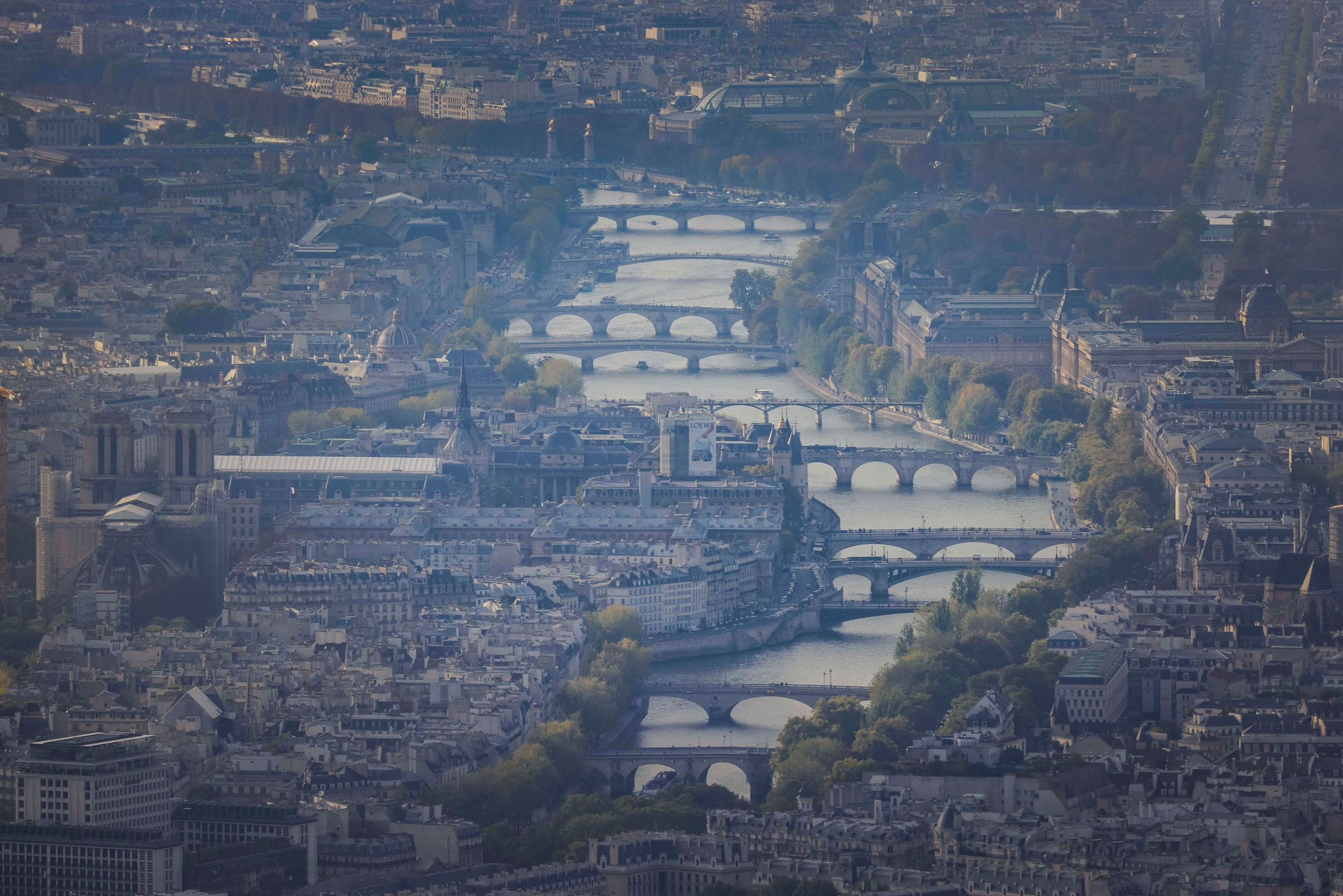 Aerial view of the Seine river winding through a smoggy Paris, France. (Laurent Grandguillot—REA/Redux)
