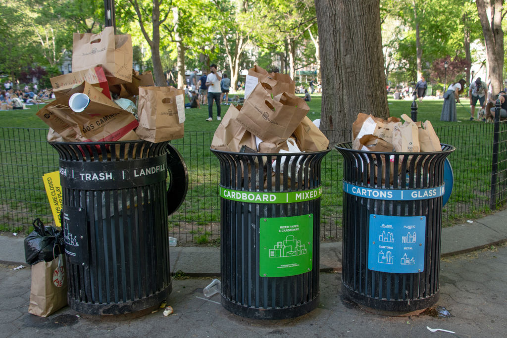 Trash bins overflow with recyclable paper bags on May 16, 2020 in New York City. (Photo by Alexi Rosenfeld/Getty Images) (Alexi Rosenfeld—Getty Images)