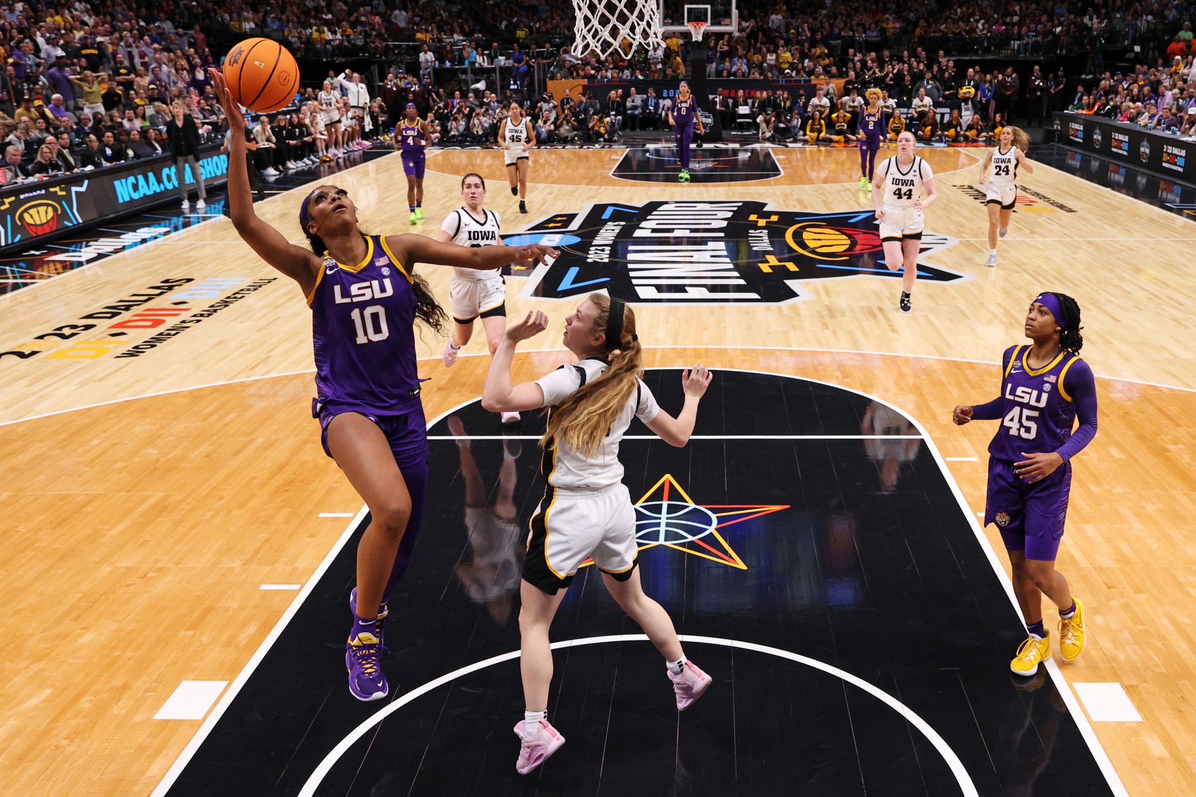 Angel Reese #10 of the LSU Lady Tigers drives to the basket against Molly Davis #1 of the Iowa Hawkeyes during the second half of the 2023 NCAA Women's Basketball Tournament championship game at American Airlines Center in Dallas, Texas, on April 02, 2023