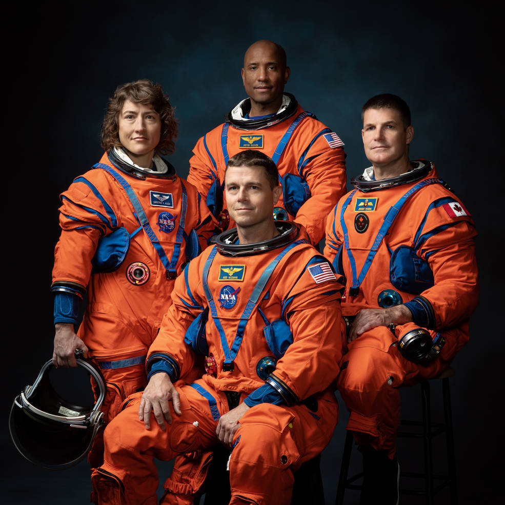 Official crew portrait for Artemis II, from left: NASA Astronauts Christina Koch, Victor Glover, Reid Wiseman (seated), Canadian Space Agency Astronaut Jeremy Hansen. (Josh Valcarcel – NASA – Johnson Space Center)